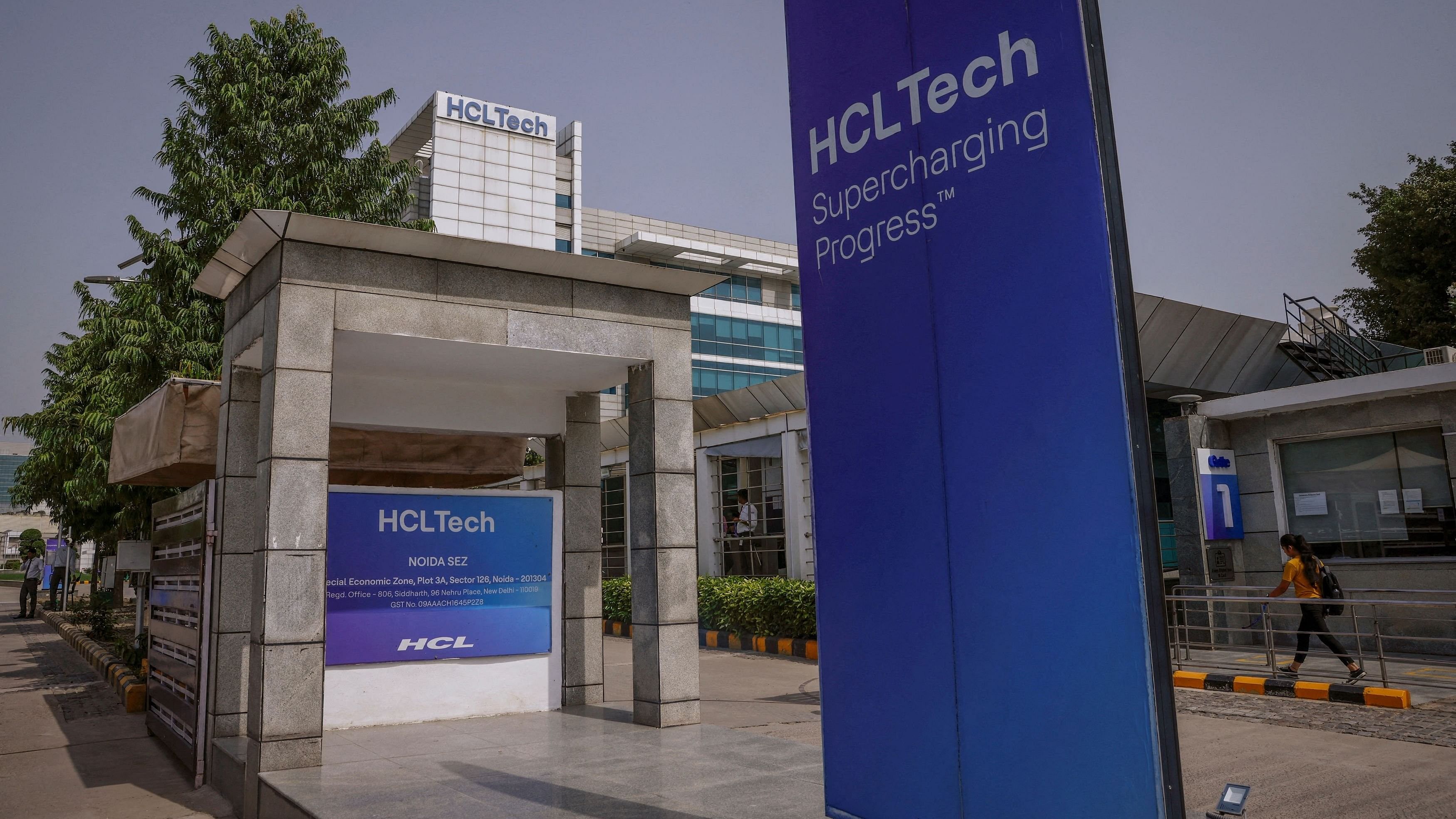 <div class="paragraphs"><p>An employee arrives for work at HCL Technologies headquarters in Noida, on the outskirts of New Delhi, India</p></div>