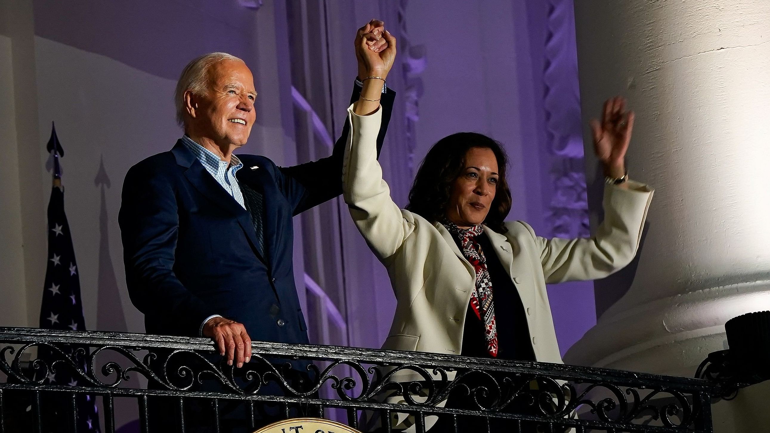 <div class="paragraphs"><p>US President Joe Biden and Vice President Kamala Harris raise their hands during  Independence Day celebration in Washington, US.</p></div>