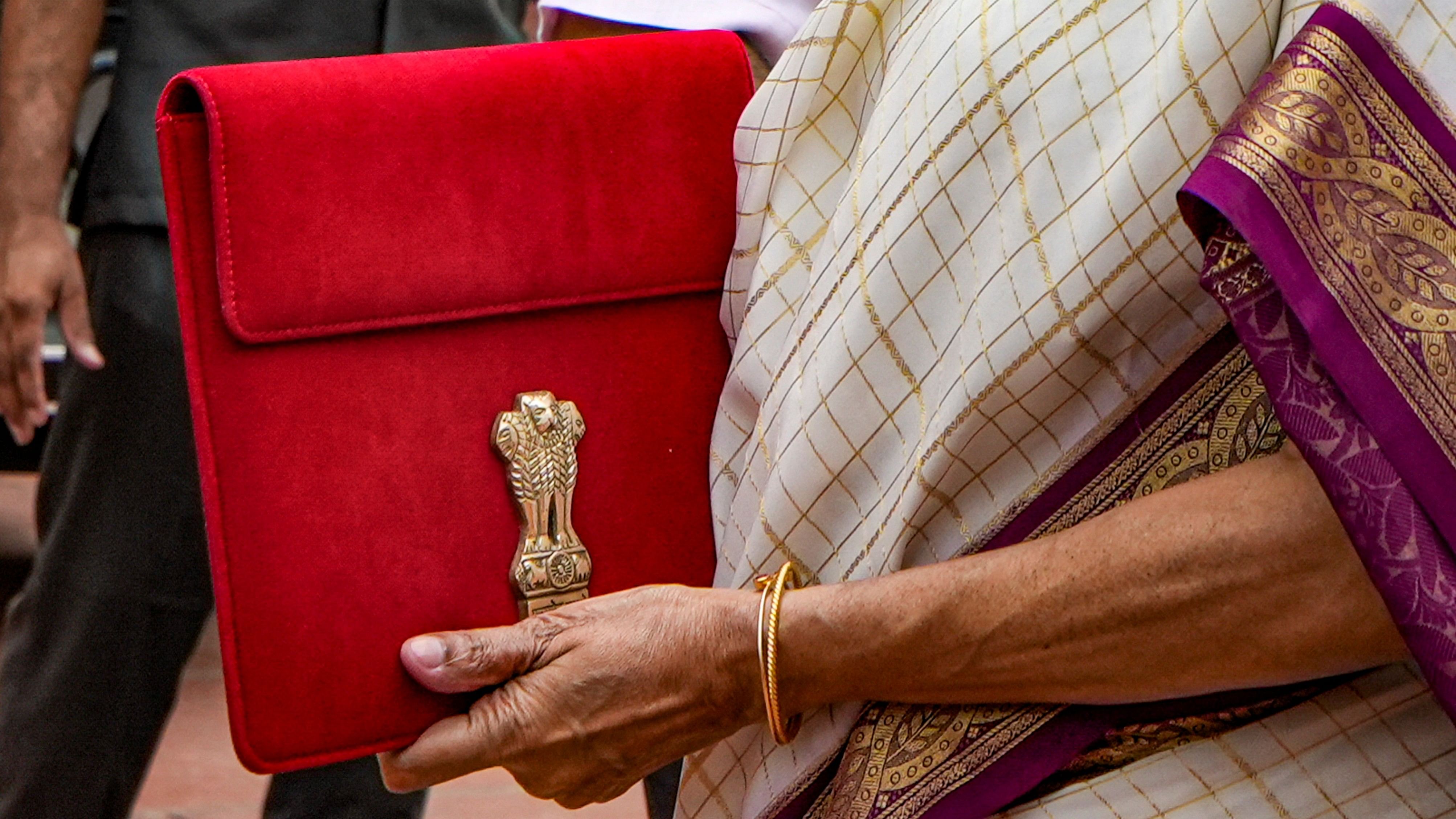 <div class="paragraphs"><p> Union Finance Minister Nirmala Sitharaman with a red pouch carrying the Budget documents.</p></div>