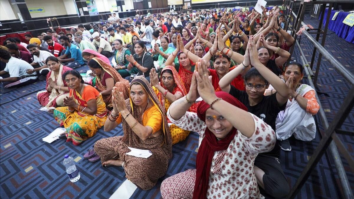 <div class="paragraphs"><p>Pilgrims sit at a waiting area to get themselves registered for the annual Amarnath Yatra.</p></div>