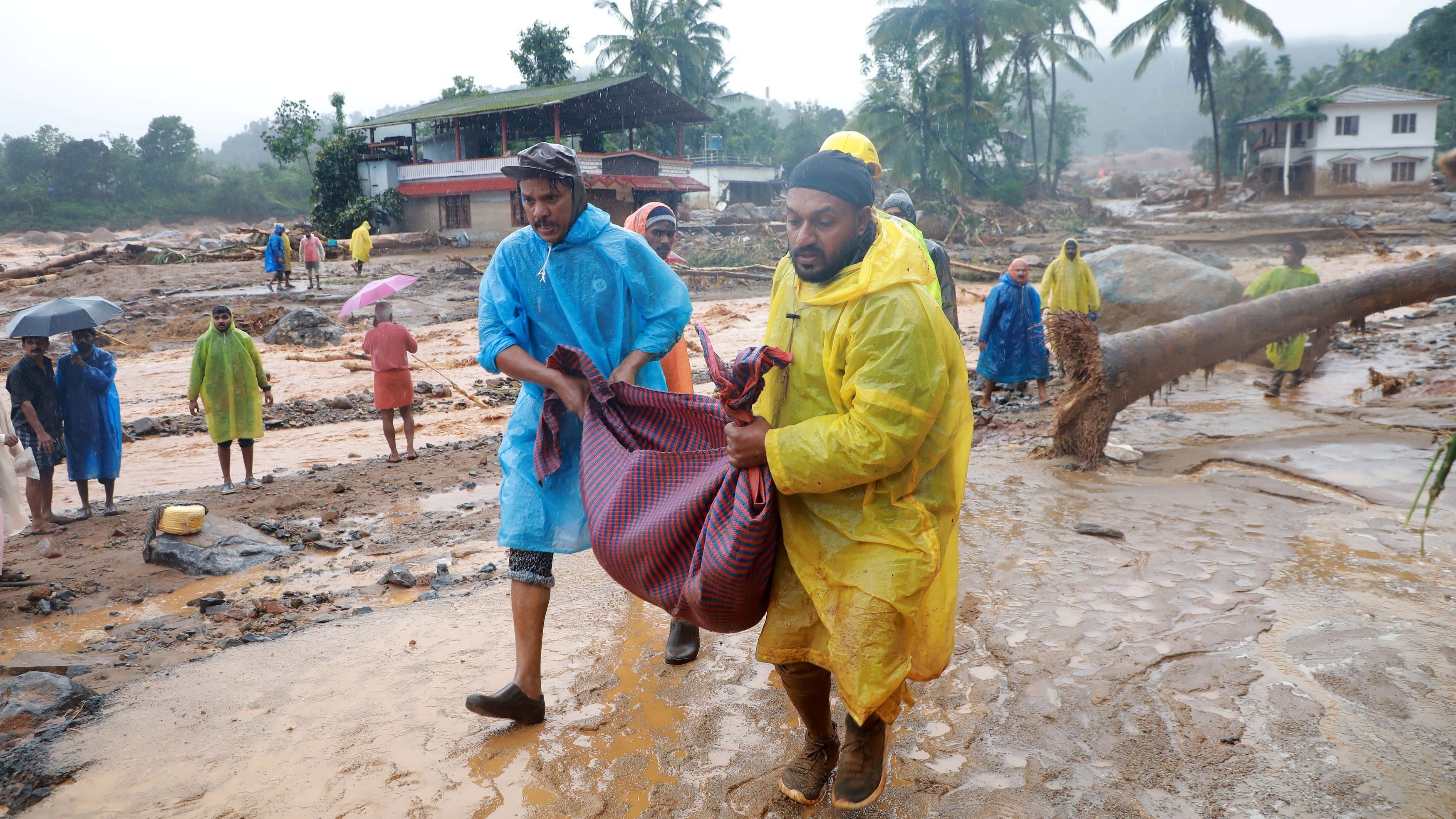 <div class="paragraphs"><p>Rescuers carry the body of a victim  after multiple landslides hit Wayanad, Kerala.</p></div>