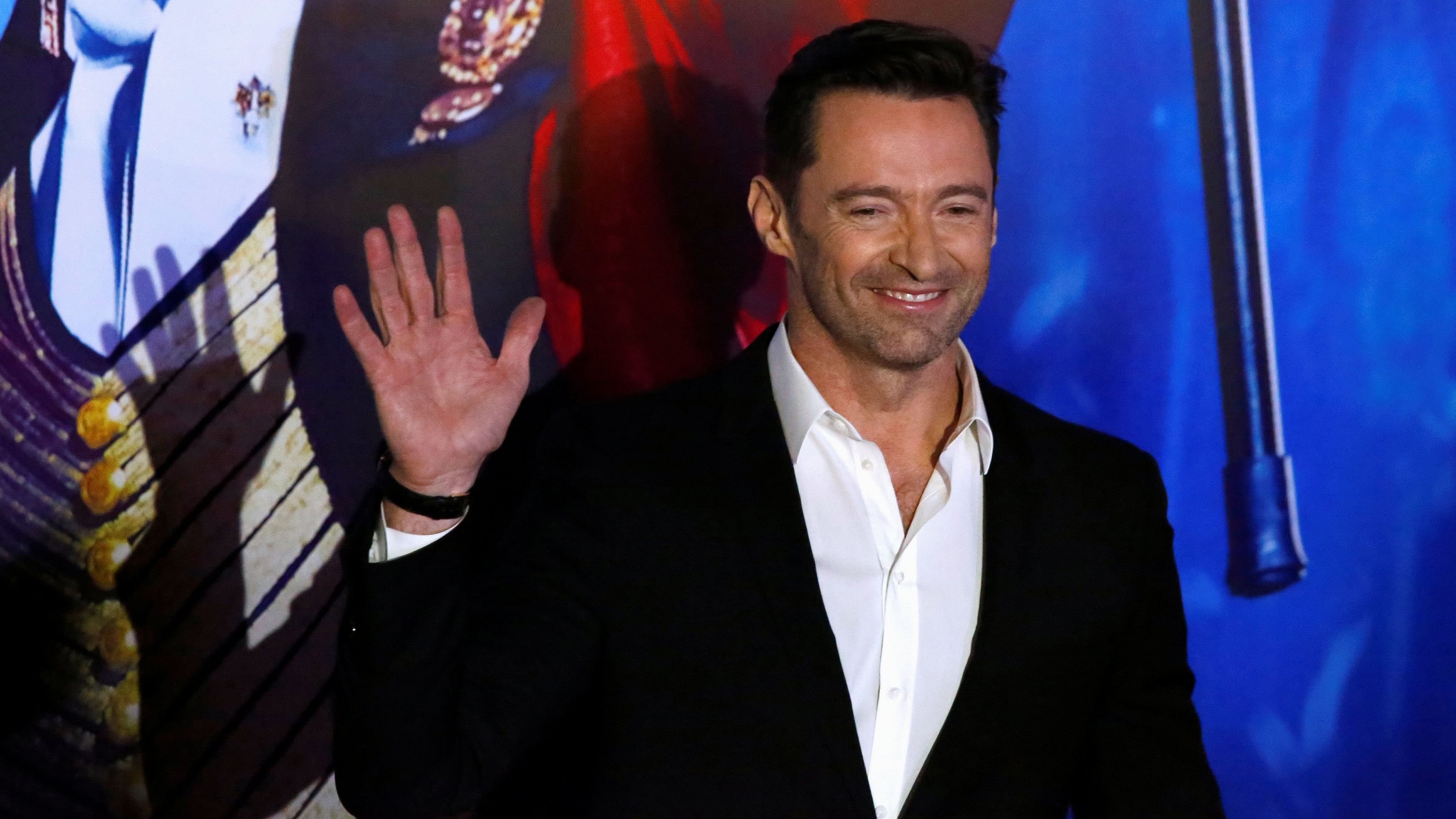 <div class="paragraphs"><p>Australian actor Hugh Jackman waves to photographers during the red carpet</p></div>