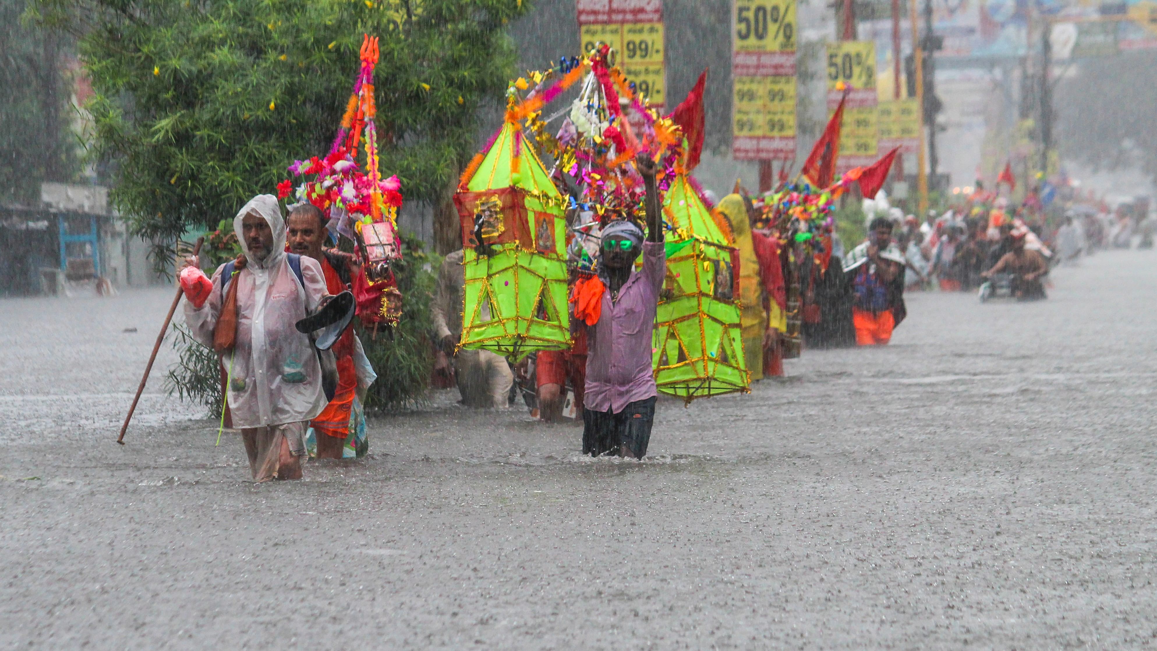 <div class="paragraphs"><p>ord Shiva devotees or 'Kanwariyas' carrying holy water from the Ganga river</p></div>