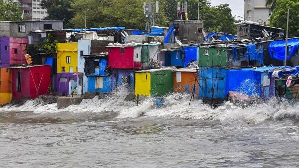 <div class="paragraphs"><p>Sea waves crash against the shore during high tide, at Badhwar Park in Mumbai.&nbsp;</p></div>