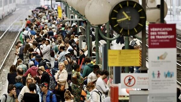 <div class="paragraphs"><p>Stranded passengers wait inside Gare du Nord station in Paris, France, 26 July 2024. France's high speed rail network TGV was severely disrupted on 26 July following a 'massive attack', according to train operator SNCF, just hours before the opening ceremony of the Paris 2024 Olympic games.</p></div>