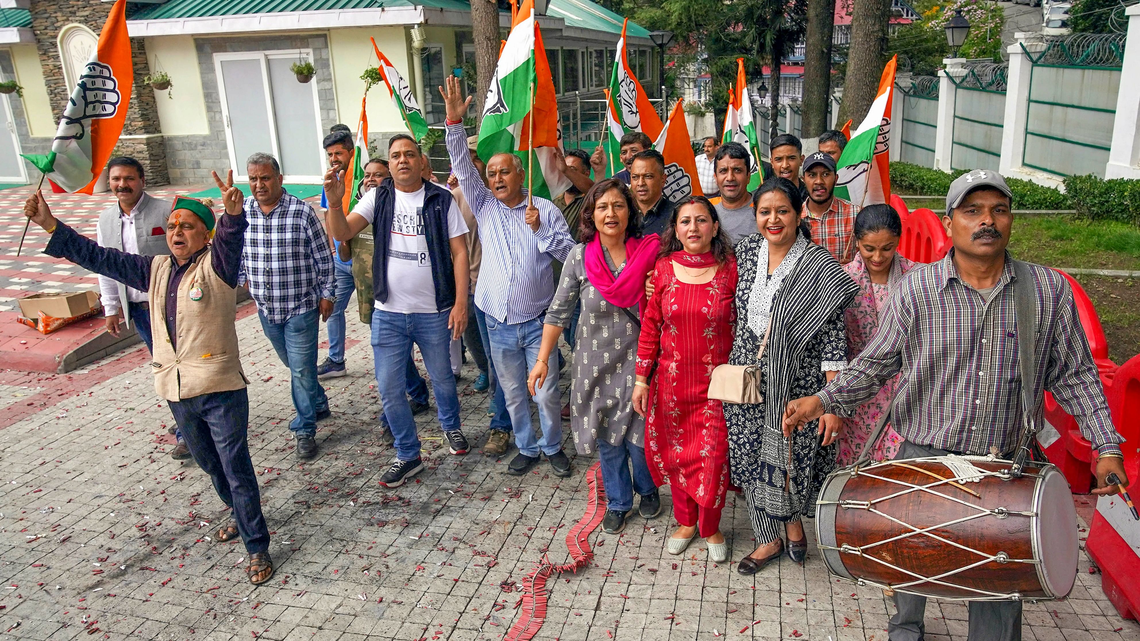 <div class="paragraphs"><p>Congress workers celebrate after party's victory on two seats in Himachal Pradesh by-elections, in Shimla, Saturday.</p></div>