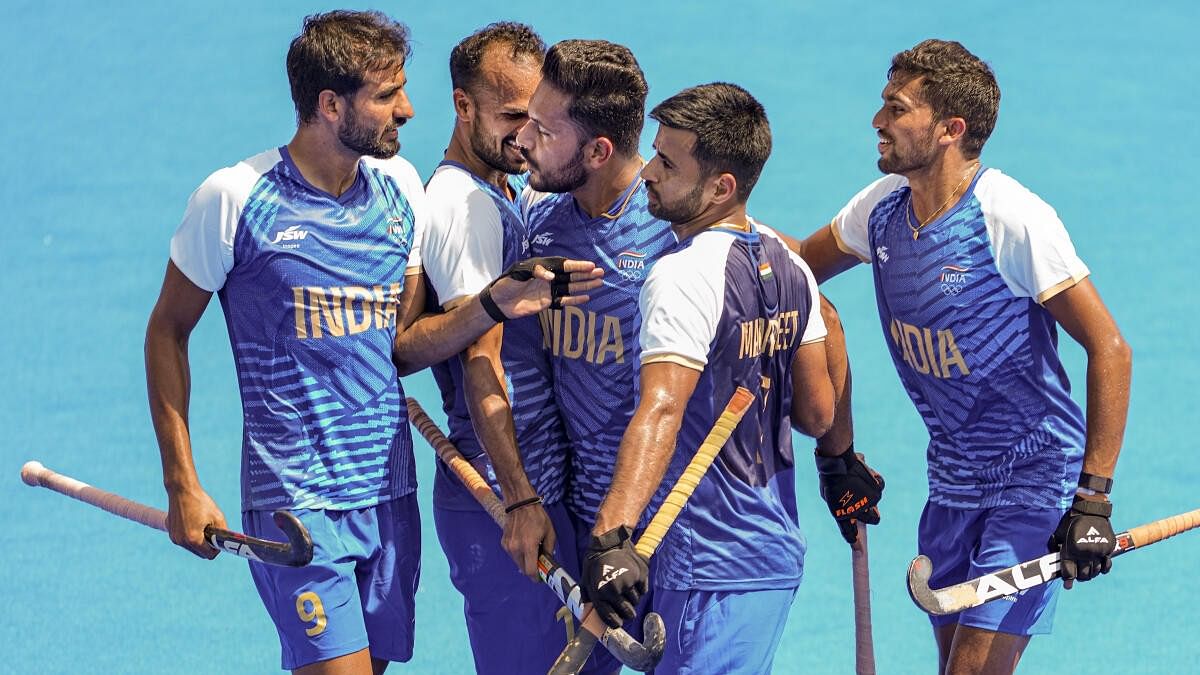 <div class="paragraphs"><p> India's captain Harmanpreet Singh celebrates with teammates after scoring a goal during the Pool B hockey match between India and Ireland at the 2024 Summer Olympics, in Paris, France, Tuesday, July 30, 2024. </p></div>