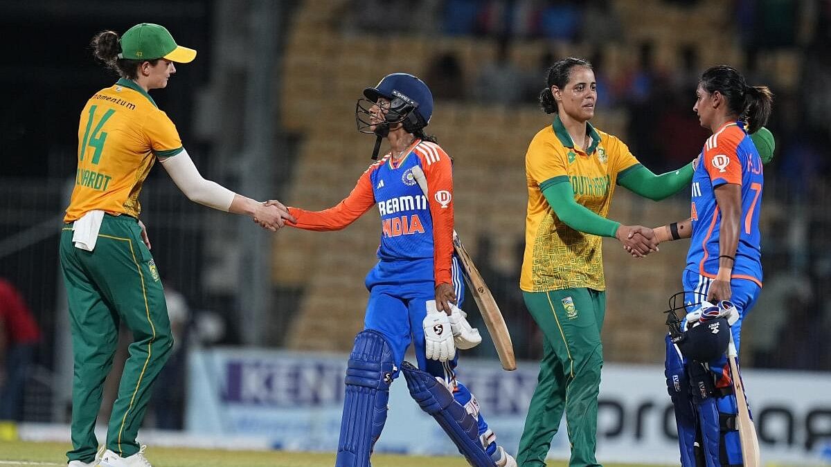 <div class="paragraphs"><p>India Women's captain Harmanpreet Kaur and Jemimah Rodrigues congratulate South Africa Women's captain Laura Wolvaardt and others after South Africa won the first T20 cricket match of a series, at the MA Chidambaram Stadium, in Chennai.</p></div>