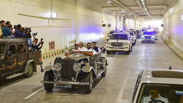 <div class="paragraphs"><p>Maharashtra CM Eknath Shinde and his deputies Devendra Fadnavis and Ajit Pawar ride a vintage Rolls Royce during the inauguration of the northbound arm of the Mumbai Coastal Road in Mumbai.</p></div>