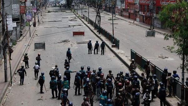 <div class="paragraphs"><p>Members of Border Guard Bangladesh (BGB) and the police work to control the protesters outside the state-owned Bangladesh Television as violence erupts after anti-quota protests by students in Dhaka, Bangladesh on July 19, 2024.</p></div>