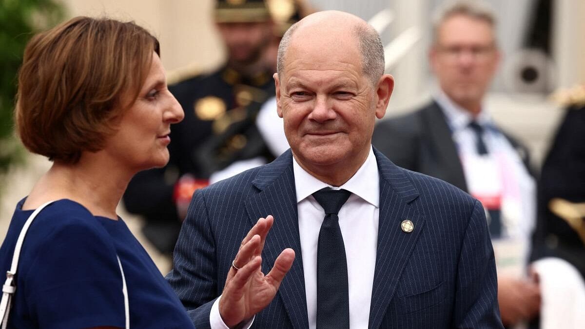 <div class="paragraphs"><p>German Chancellor Olaf Scholz and his wife Britta Ernst arrive to attend a reception for heads of state and government at the Elysee Palace before the opening ceremony of the Paris 2024 Olympic Games in Paris, France, July 26, 2024.</p></div>