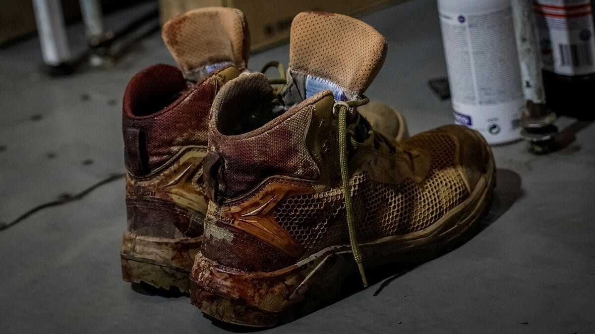 <div class="paragraphs"><p>A pair of bloodied army boots of a Ukrainian serviceman is seen inside a medical stabilisation point, near the town of Chasiv Yar, in Donetsk region.</p></div>