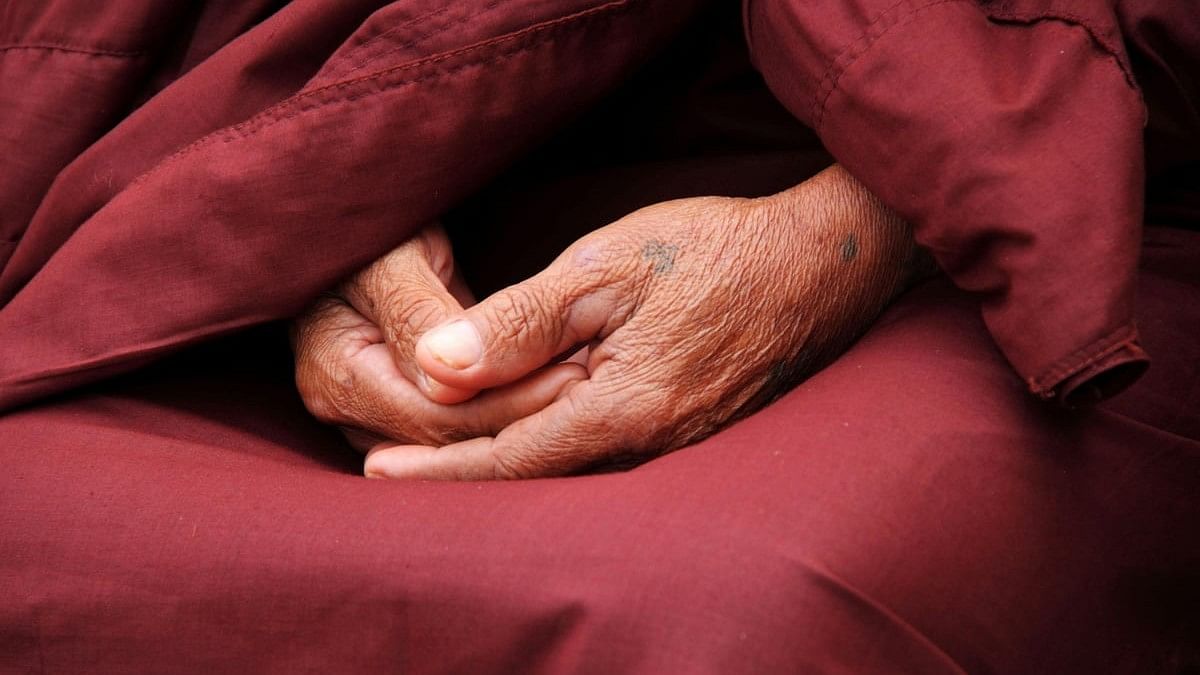 <div class="paragraphs"><p>Representative image showing a person's folded handed as he meditates.</p></div>