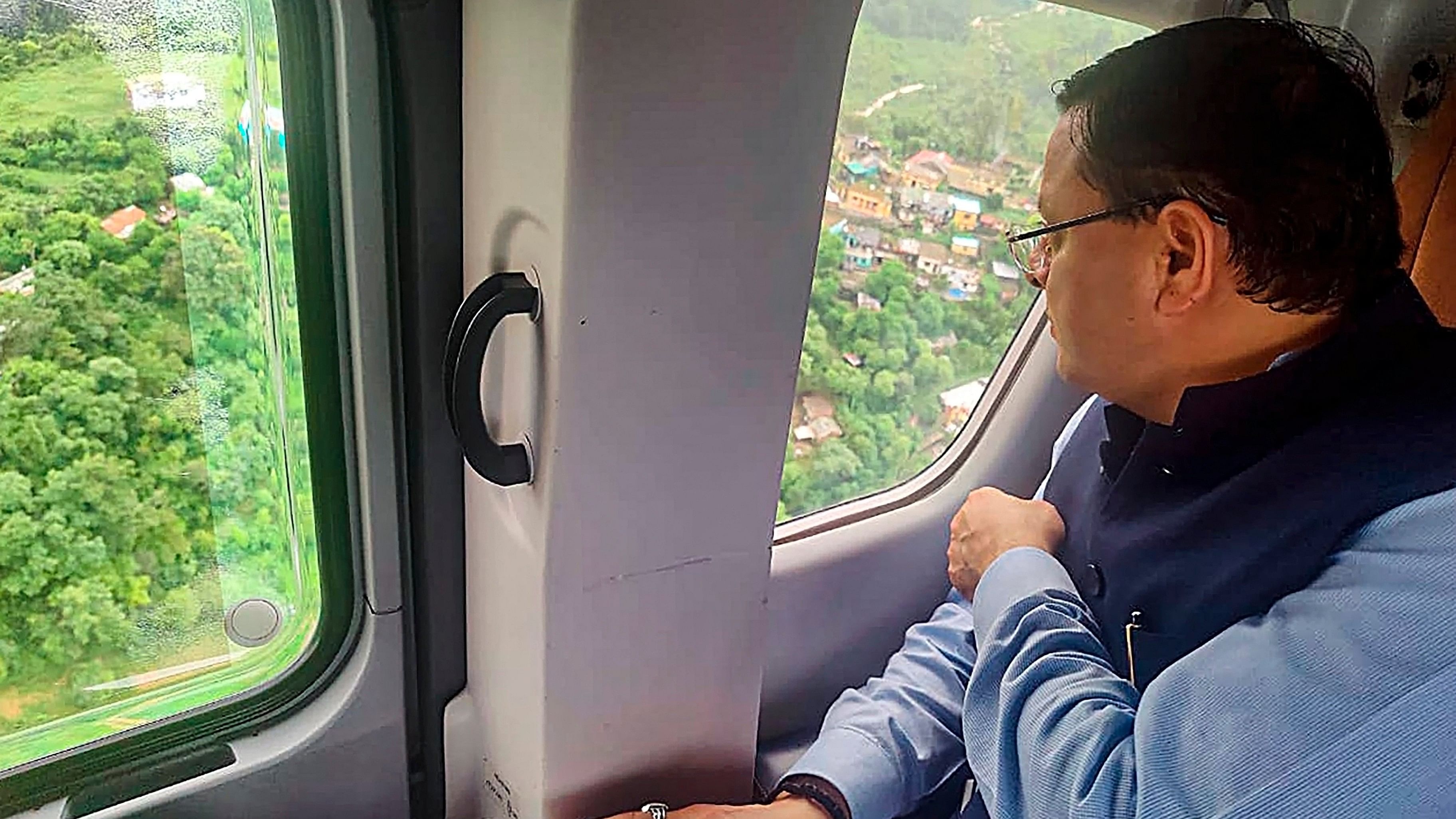 <div class="paragraphs"><p> Uttarakhand CM Pushkar Singh Dhami conducts an aerial survey of flood-affected areas, in Rishikesh, Monday.</p></div>