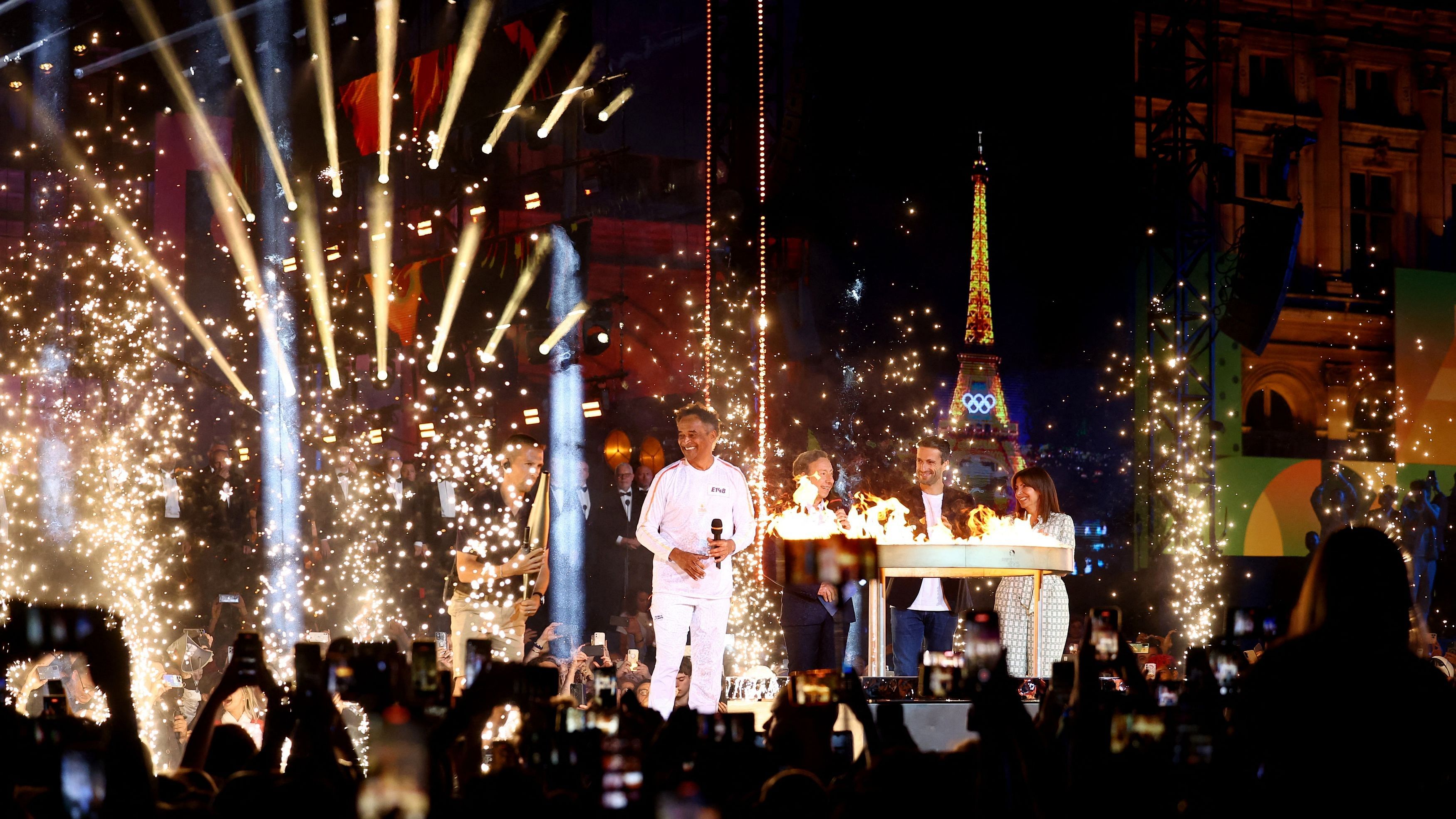 <div class="paragraphs"><p>Former tennis player Yannick Noah, President of the Organising Committee of the Paris 2024 Olympic and Paralympic Games Tony Estanguet, presenter Stephane Bern and Mayor of Paris Anne Hidalgo during the lighting of the cauldron ceremony.</p></div>