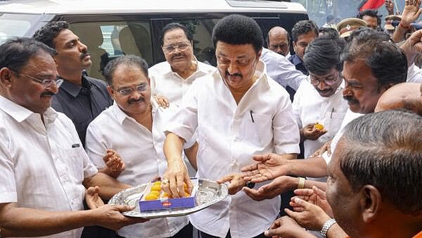 <div class="paragraphs"><p>DMK Chief and Tamil Nadu Chief Minister MK Stalin distributes sweets to party workers as party candidate leads during counting of Vikravandi Assembly by-poll votes, in Chennai on Saturday, July 13, 2024.</p></div>