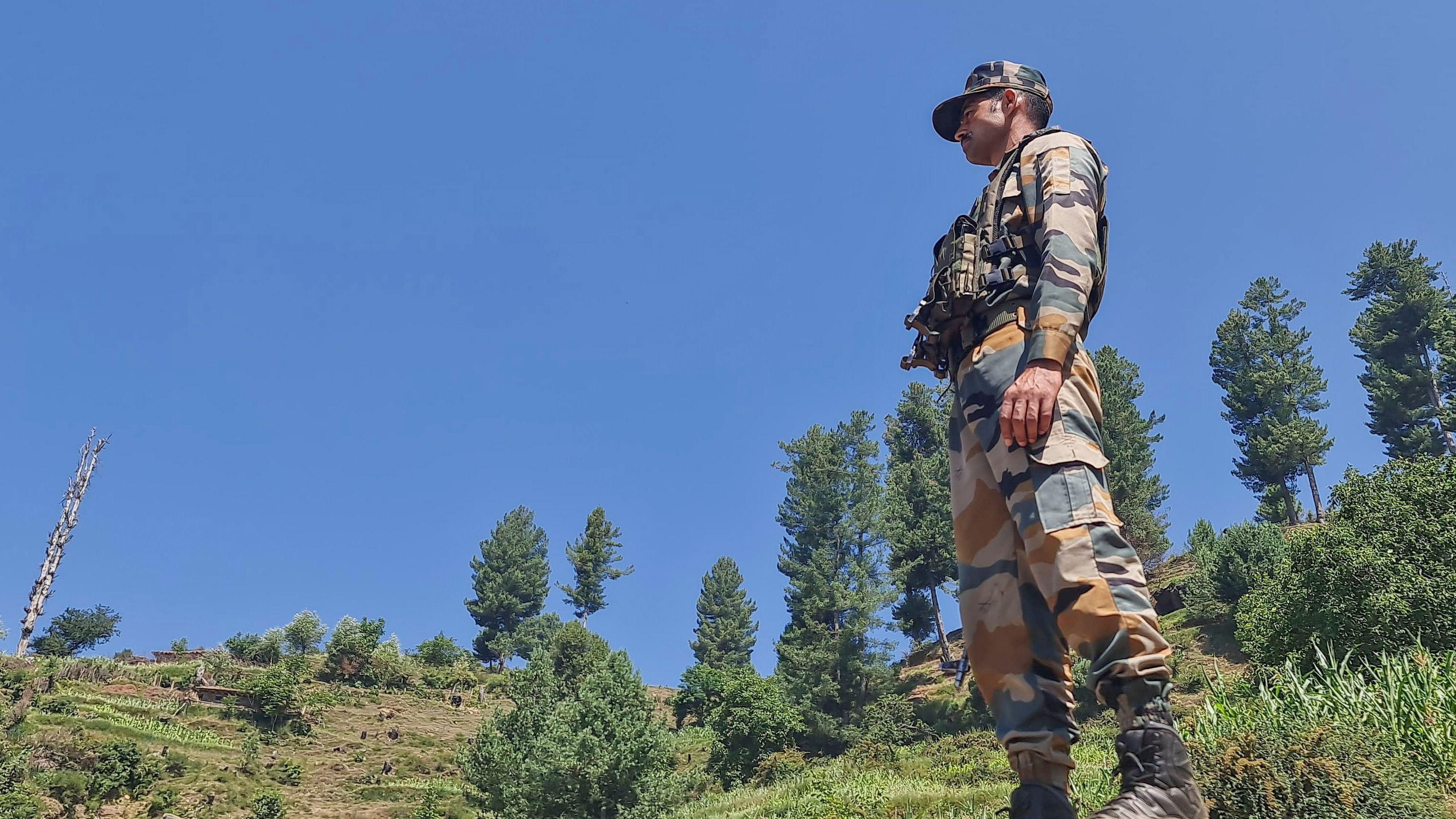 <div class="paragraphs"><p>A security personnel stands guard during an anti-terror operation after four Army personnel, including an officer, died after being injured in a gunfight with terrorists, in Doda district of Jammu and Kashmir.</p></div>