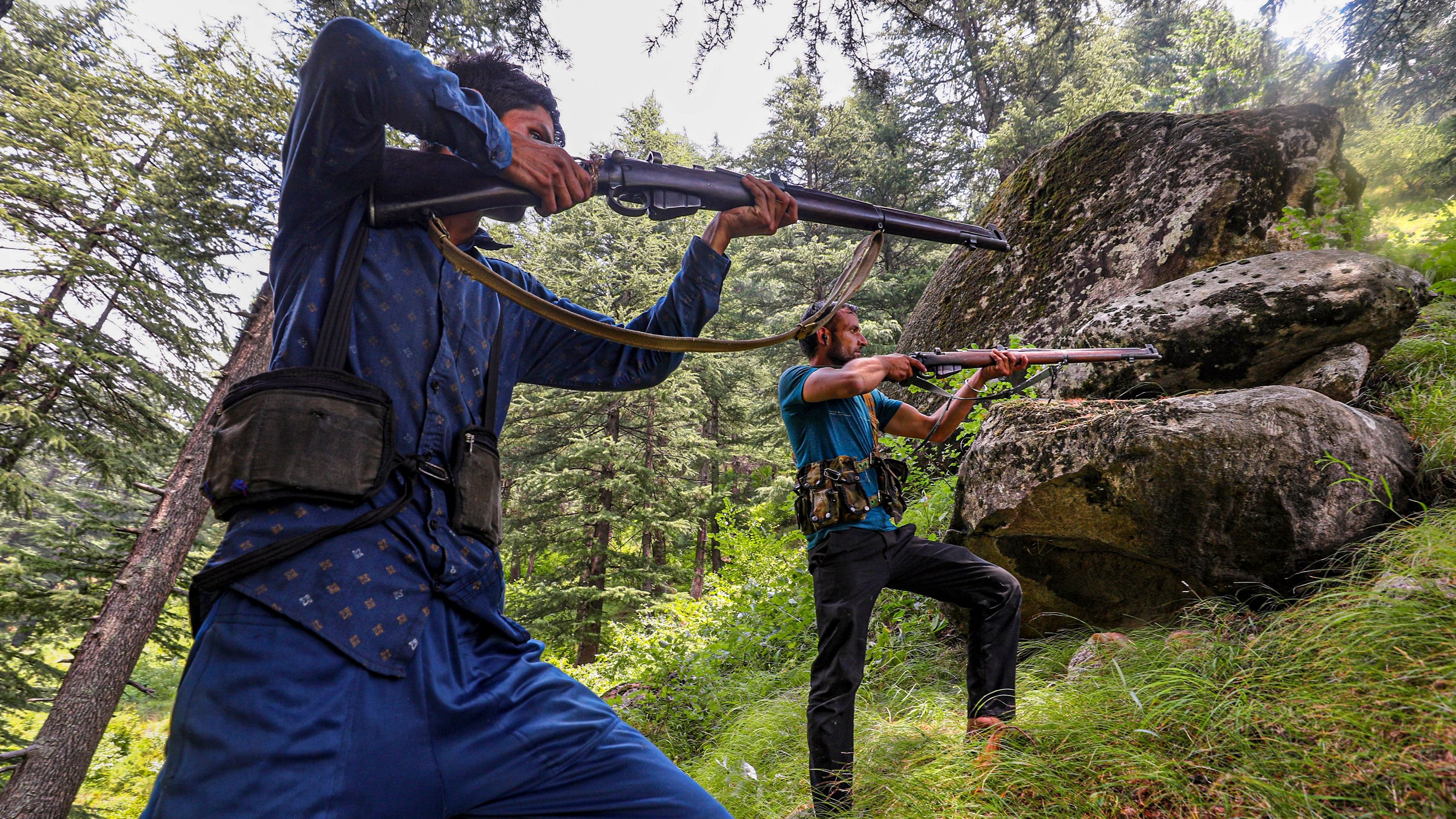 <div class="paragraphs"><p>Village Defence Guards keep vigil at a forest area near the encounter site, in Desa area of Doda district, Jammu and Kashmir, Wednesday, July 17, 2024. </p></div>