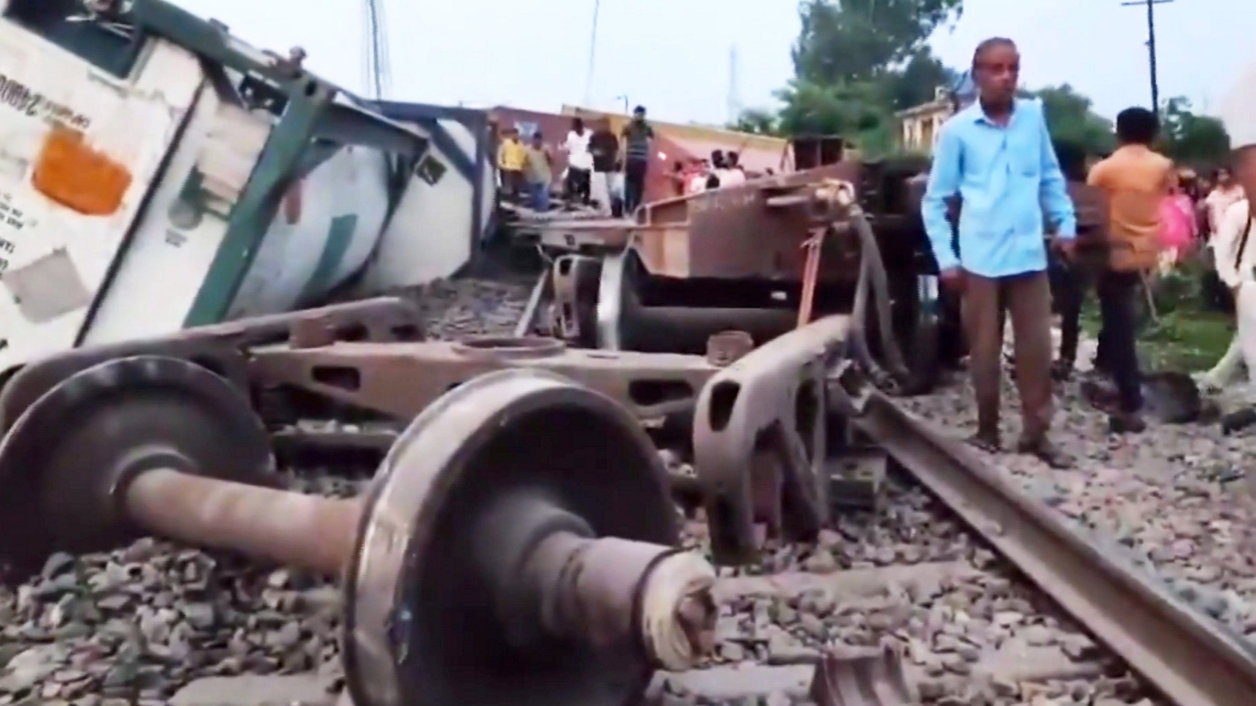 <div class="paragraphs"><p>People gather after a goods train derailed, in Amroha, Saturday.</p></div>