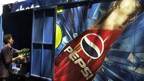 <div class="paragraphs"><p>A loading vehicle with a poster showing the picture of Pepsi, which is one of Pepsico's many global brands.</p></div>