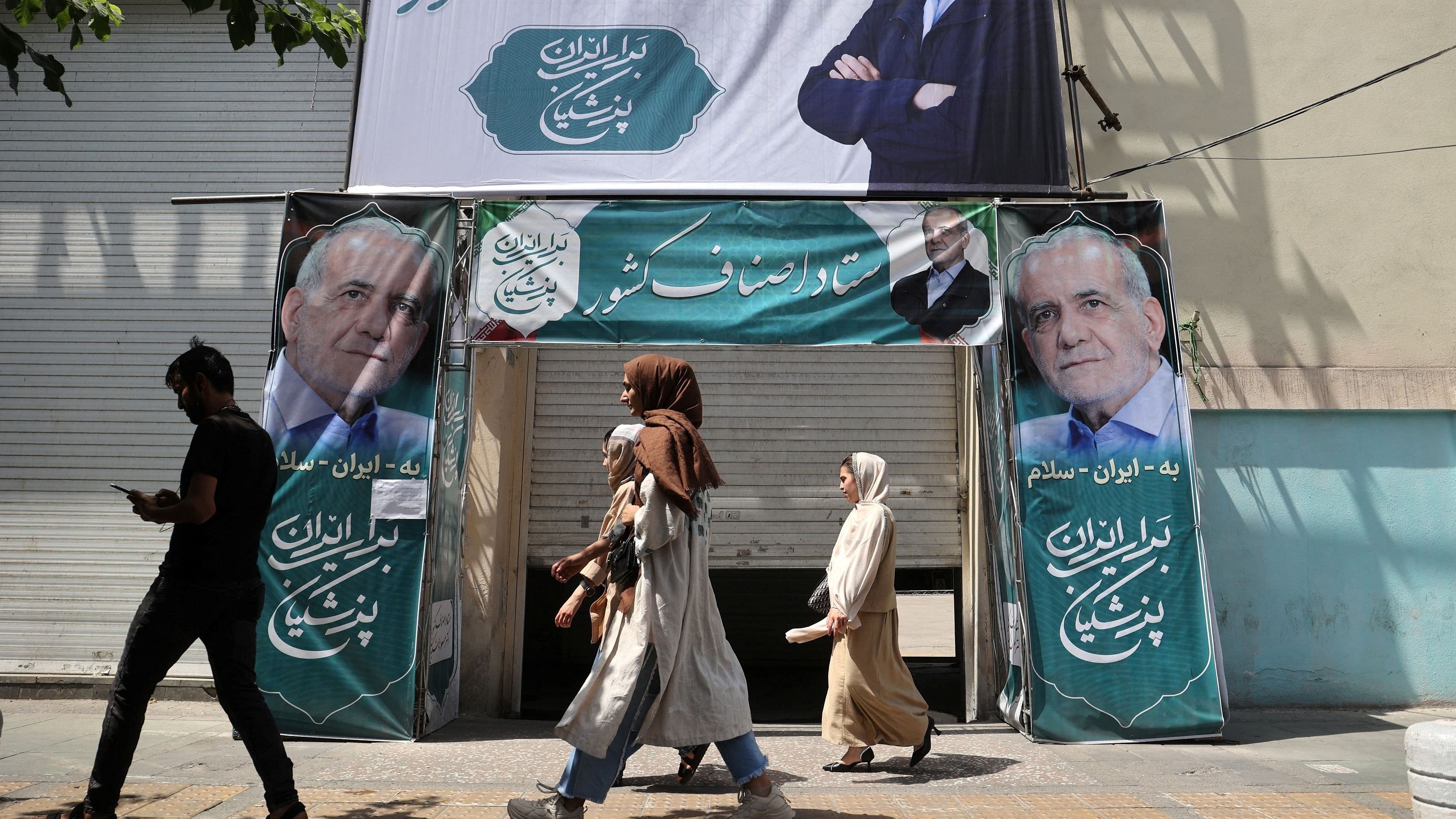 <div class="paragraphs"><p>A banner featuring presidential candidate Masoud Pezeshkian is displayed on a street.</p></div>