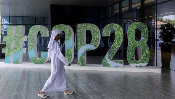 <div class="paragraphs"><p>A person walks past a #COP28 sign during 'The Changemaker Majlis', a one-day CEO-level thought leadership workshop focused on climate action in Abu Dhabi, United Arab Emirates in October, 2023.</p></div>