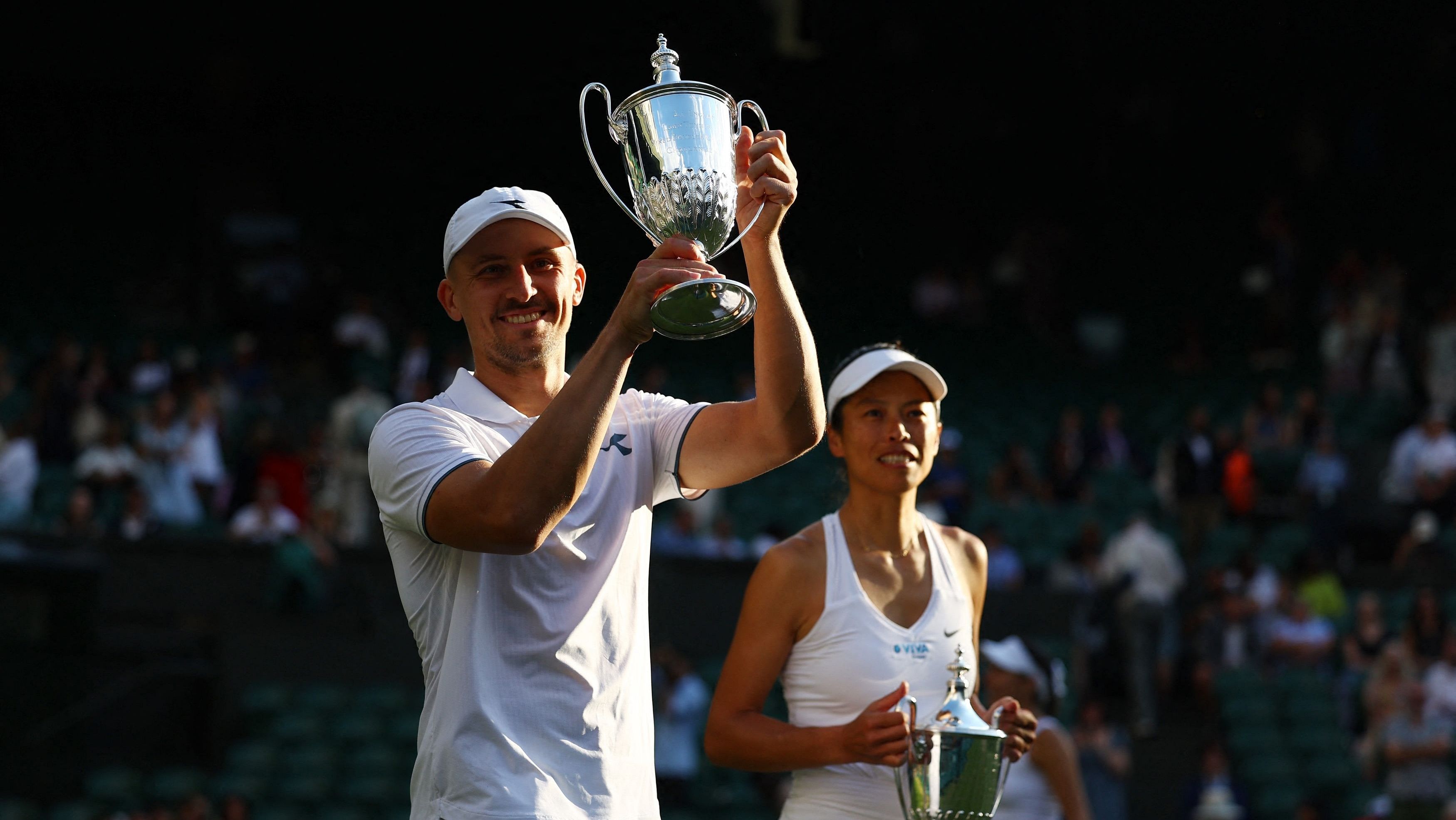 <div class="paragraphs"><p>2024 Winners Poland's Jan Zielinski and Taiwan's Su-Wei Hsieh celebrate with their trophies after winning the mixed doubles final against Mexico's Santiago Gonzalez and Giuliana Olmos.</p></div>