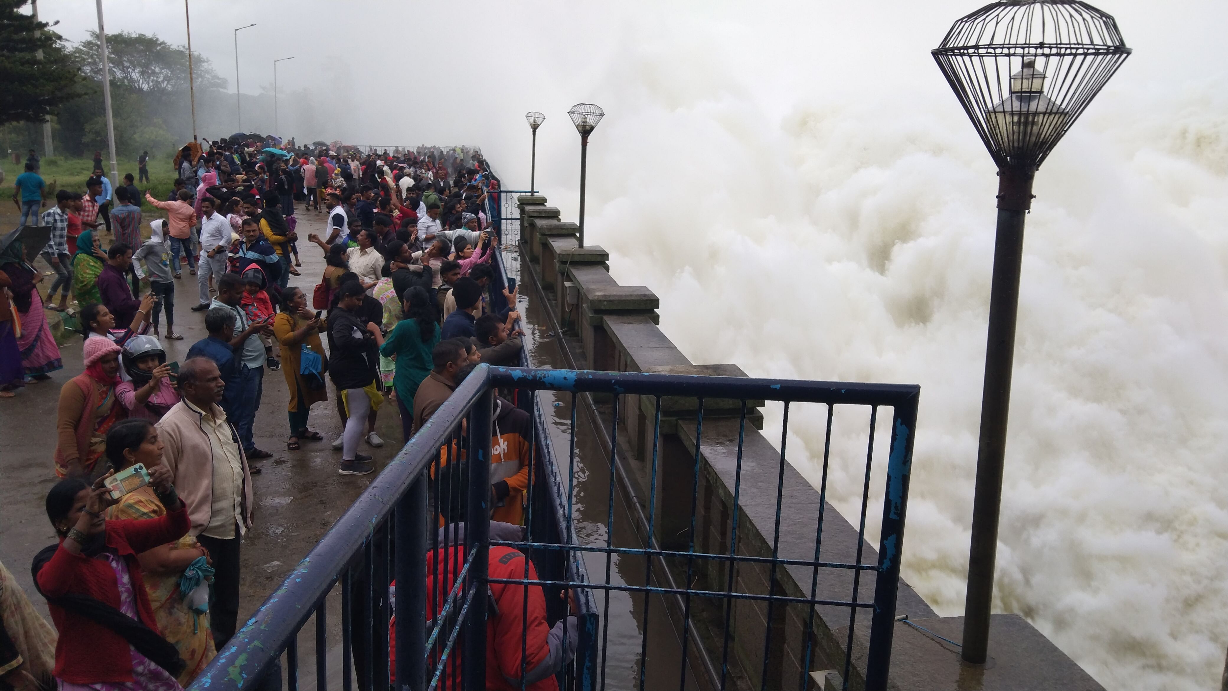 <div class="paragraphs"><p>A large number of people enjoy the view of water being released from Hemavathi dam in Gorur, Hassan taluk. </p></div>