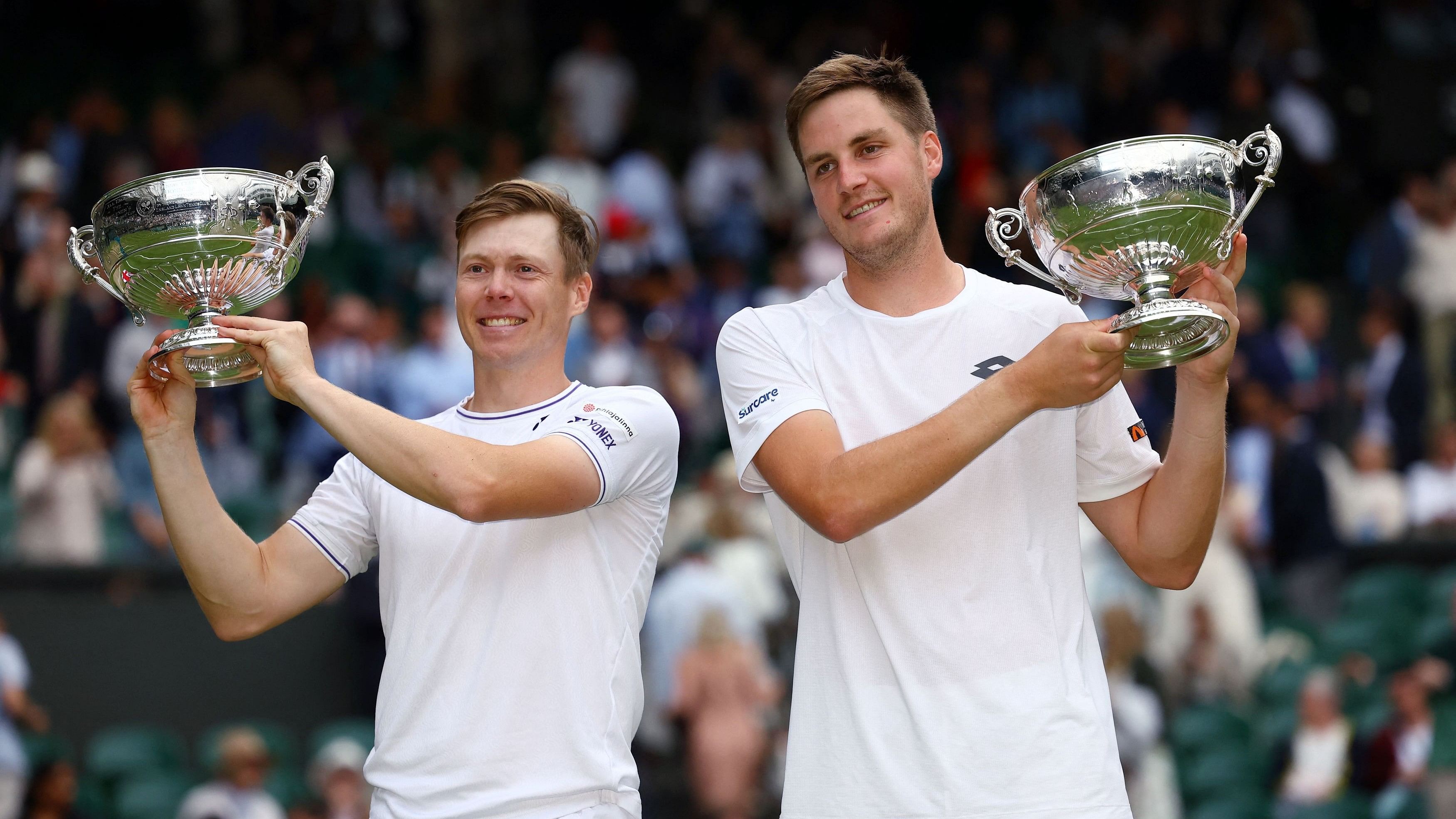 <div class="paragraphs"><p>Britain's Henry Patten and Finland's Harri Heliovaara celebrate with their trophies after winning the men's doubles final against Australia's Max Purcell and Australia's Jordan Thompson.</p></div>