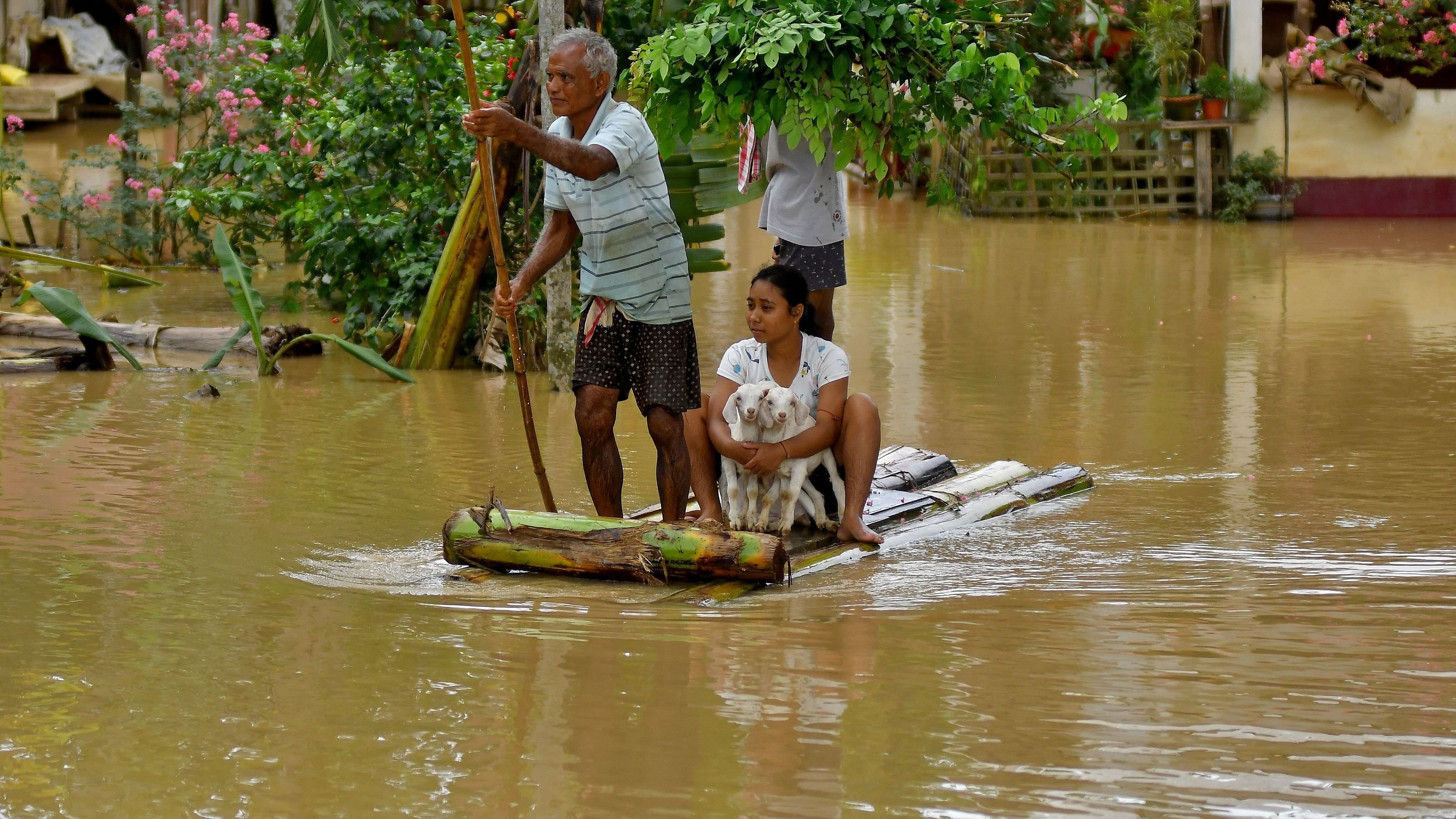 <div class="paragraphs"><p>Flood-affected people use a makeshift raft to shift their lamb to a safer place following heavy rains at the Patiapam village in Nagaon district, in the northeastern state of Assam, India, July 3, 2024. </p></div>