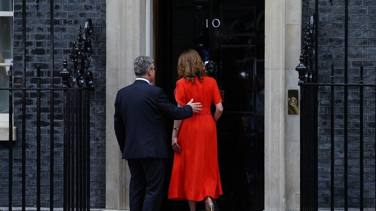 <div class="paragraphs"><p>British Prime Minister Keir Starmer and his wife Victoria Starmer enter Downing Street 10.</p></div>