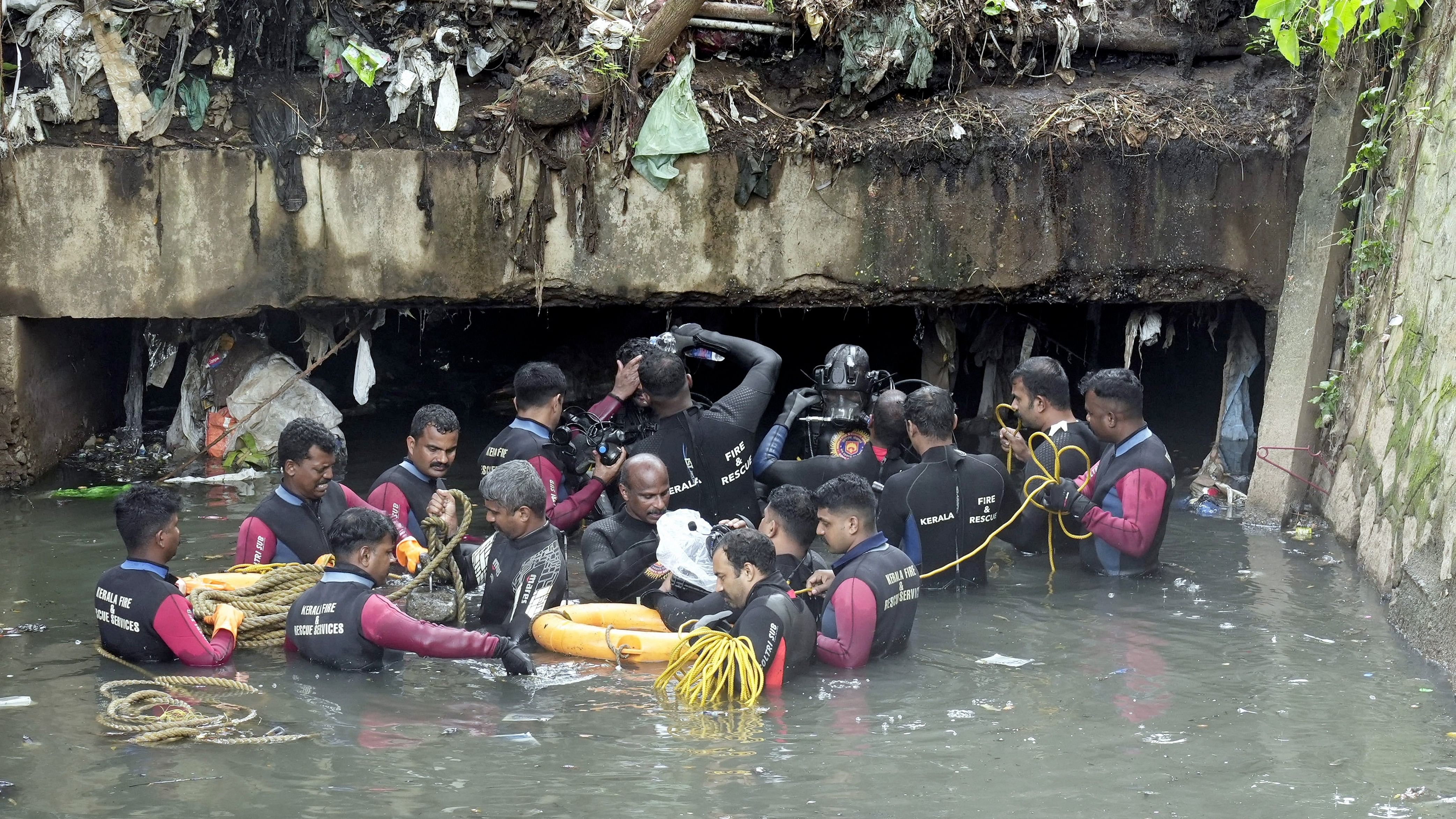 <div class="paragraphs"><p>Thiruvananthapuram: Kerala Fire and Rescue Services personnel during a search operation after a sanitation worker was swept away in rainwater while cleaning the Amayizhanchan canal.</p></div>