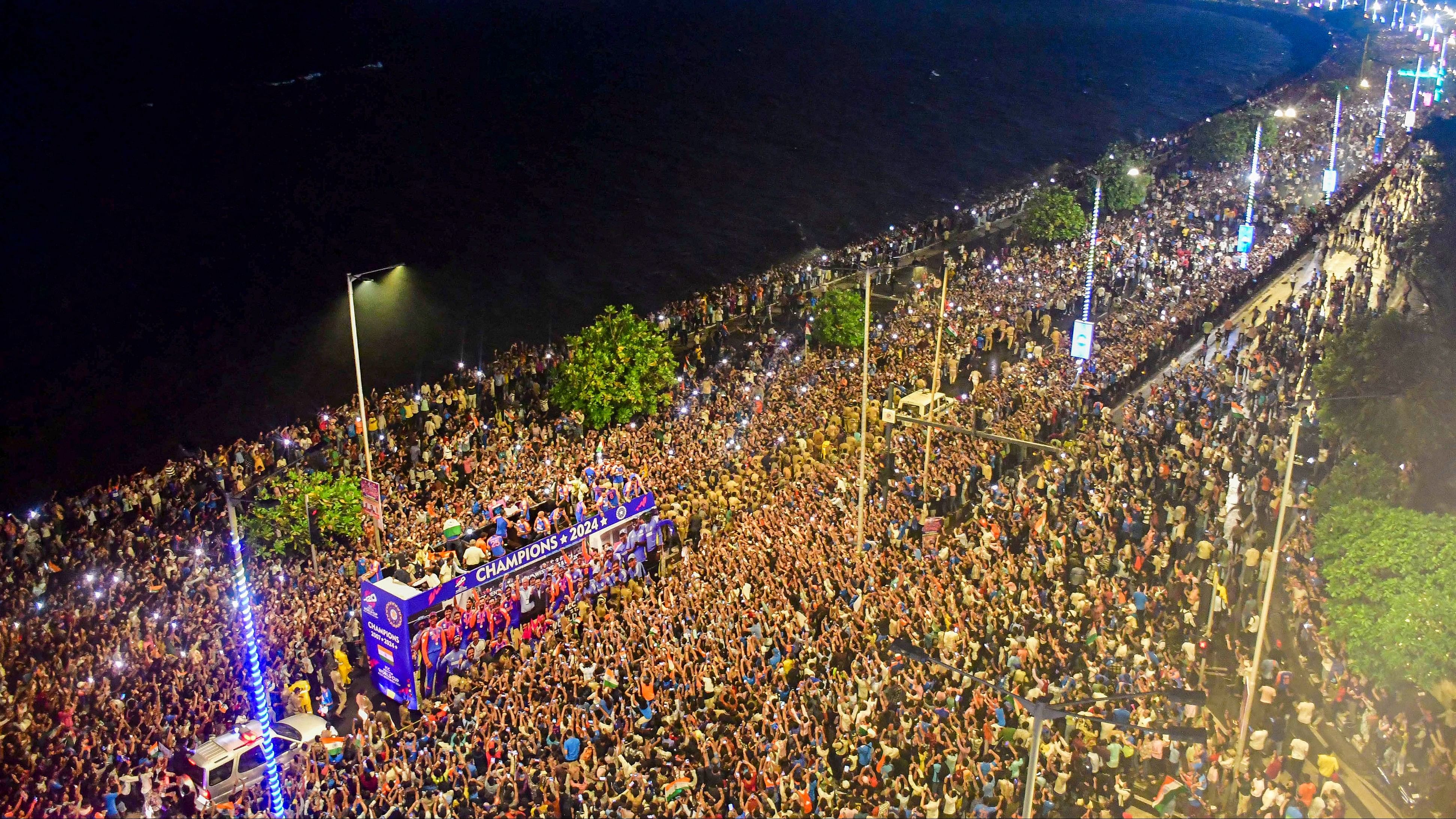 <div class="paragraphs"><p>Fans surround the open bus during the victory parade of the T20 World Cup-winning Indian cricket team, in Mumbai, Thursday.</p></div>