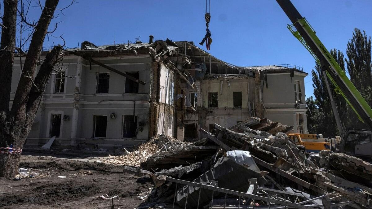 <div class="paragraphs"><p>An emergency service worker is suspended above the blast site following a Russian missile strike on the Okhmatdyt Children's Hospital, amid Russia's attack on Ukraine, in Kyiv, Ukraine.</p></div>