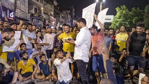 <div class="paragraphs"><p>Students hold protest demanding justice for three UPSC aspirants that were killed on Saturday after getting stuck in the flooded basement of an Old Rajinder Nagar's coaching, at Mukherjee Nagar in New Delhi, Tuesday, July 30, 2024.</p></div>