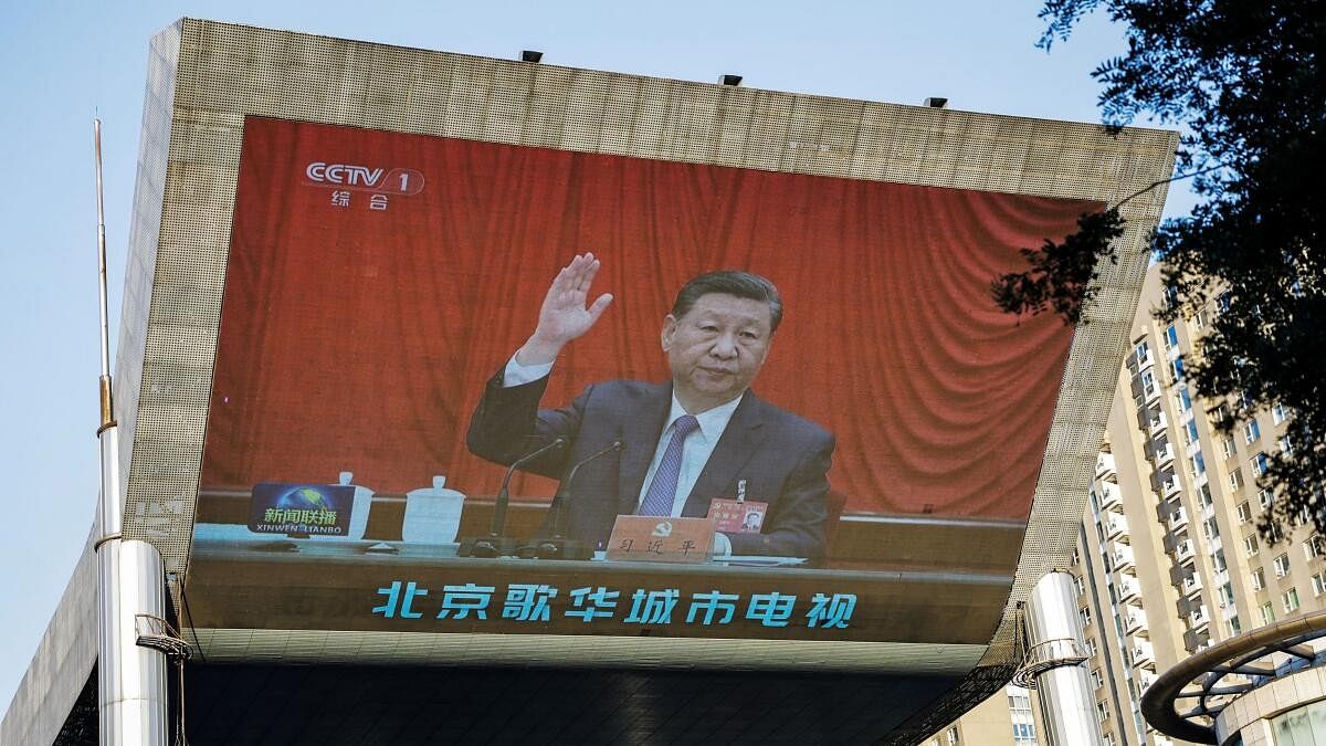 <div class="paragraphs"><p>A giant screen shows news footage of Chinese President Xi Jinping attending the third plenary session of the 20th Central Committee of the Communist Party of China.</p></div>