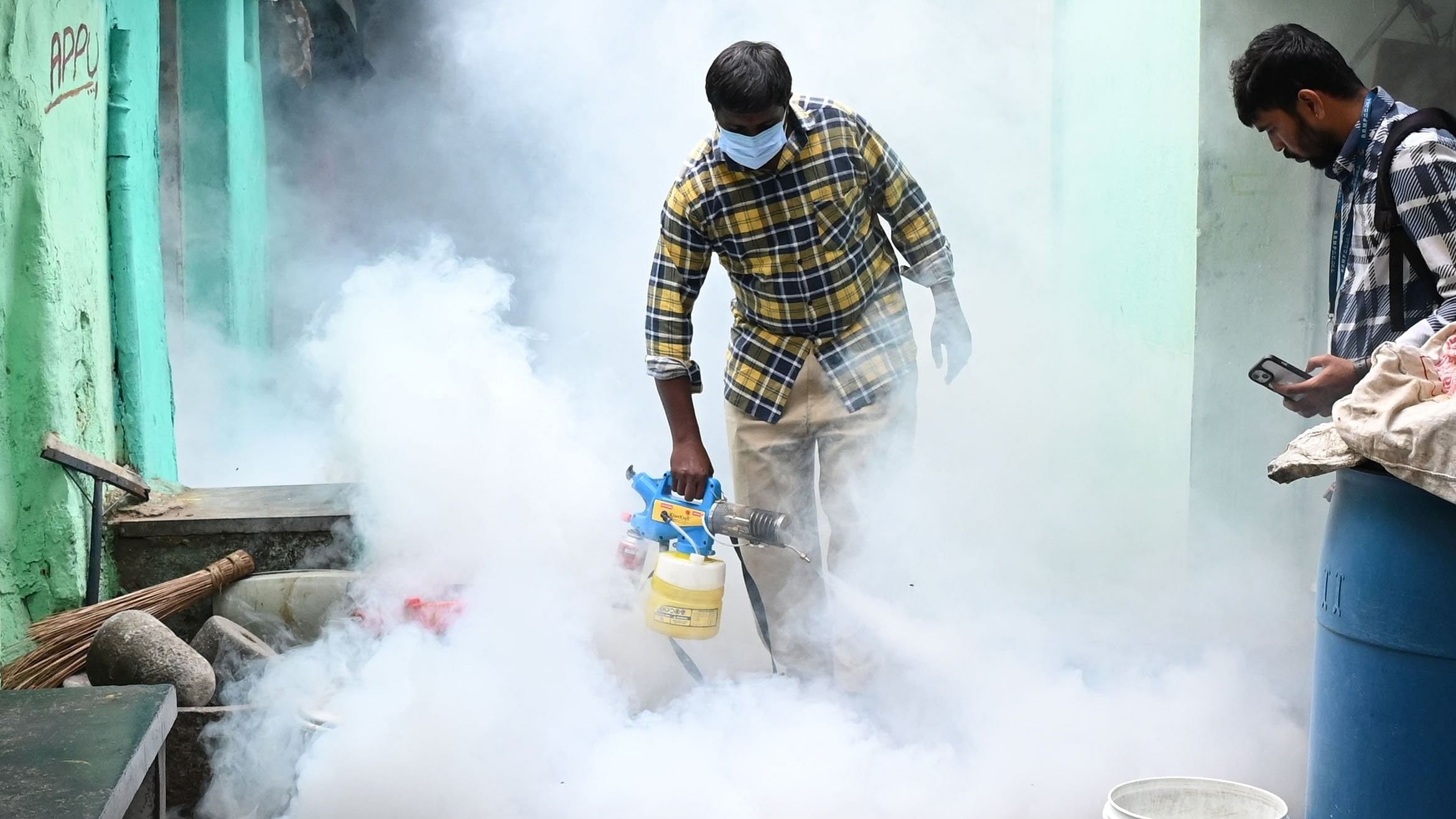 <div class="paragraphs"><p>A health department worker fogging in a bid to kill mosquitoes.</p></div>