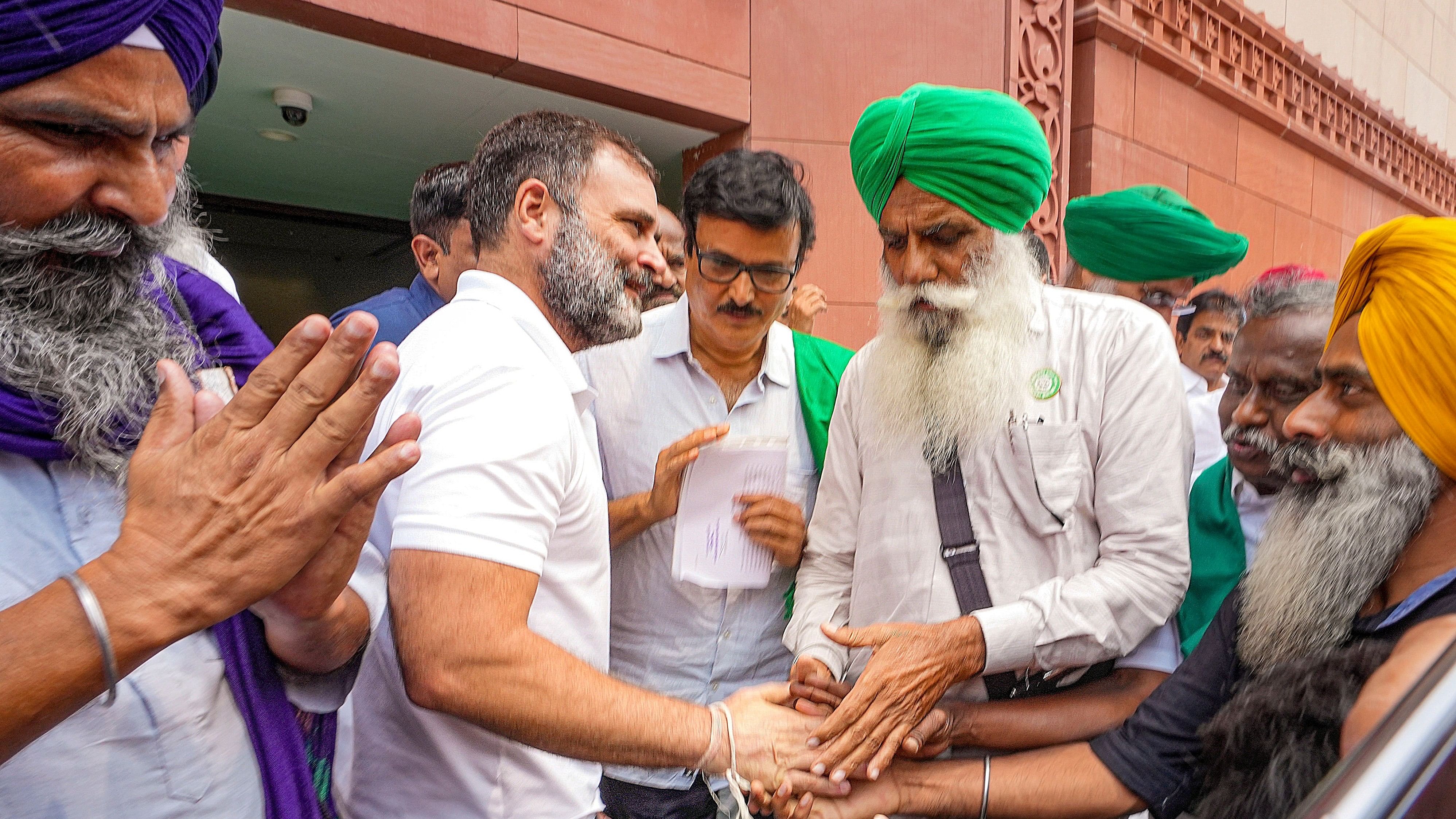 <div class="paragraphs"><p>Leader of Opposition in Lok Sabha and Congress MP Rahul Gandhi being greeted by farmer leaders during the Monsoon session of the Parliament, in New Delhi, Wednesday, July 24, 2024. </p></div>