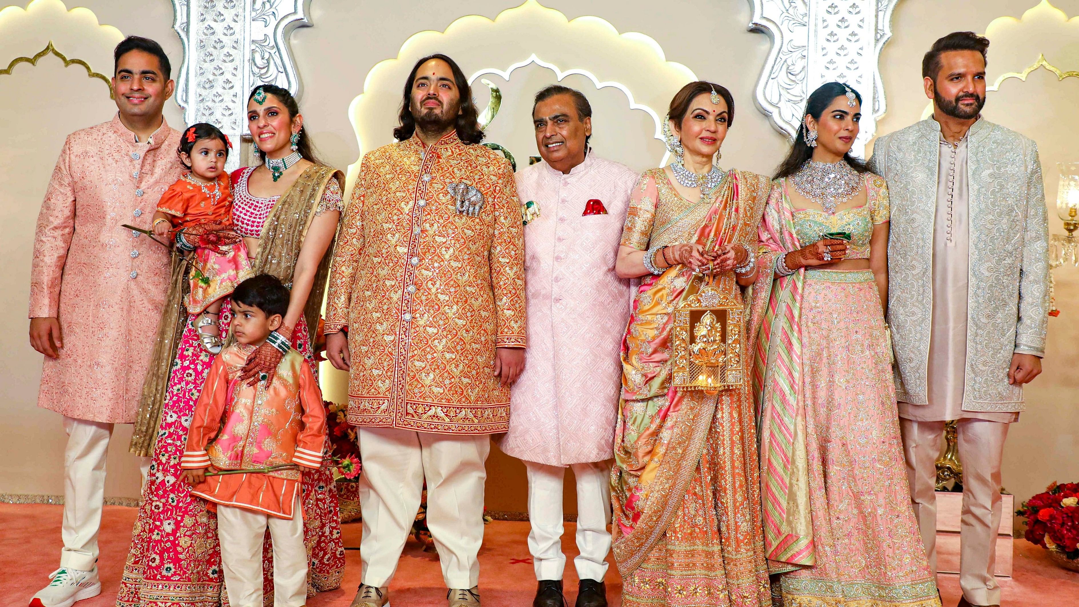 <div class="paragraphs"><p>Reliance Industries Chairman Mukesh Ambani with wife Nita Ambani, sons Akash and Anant Ambani, daughter-in-law Shloka Mehta Ambani, daughter Isha Ambani and son-in-law Anand Piramal, poses for pictures at Jio World Convention Centre, in Mumbai, Friday.</p></div>