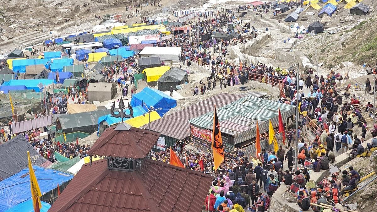 <div class="paragraphs"><p>Devotees arrive at the Amarnath Temple to offer prayers during the annual ‘Amarnath Yatra’, in Anantnag district.</p></div>