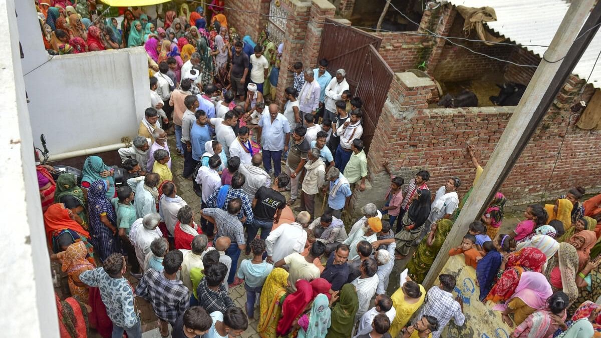 <div class="paragraphs"><p>Relatives mourn at the residence of three members of their family who died in the recent stampede at the 'satsang' of Baba Narayan Hari alias Saakar Vishwa Hari Bhole Baba, in Hathras.</p></div>