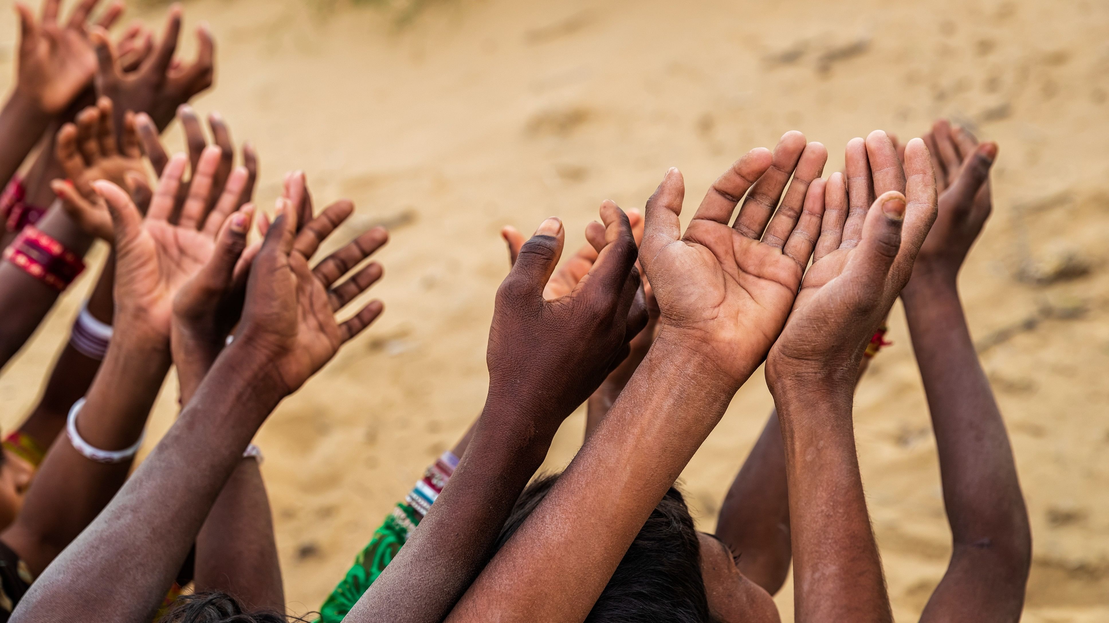 <div class="paragraphs"><p>Representative image showing children with outstretched hands</p></div>