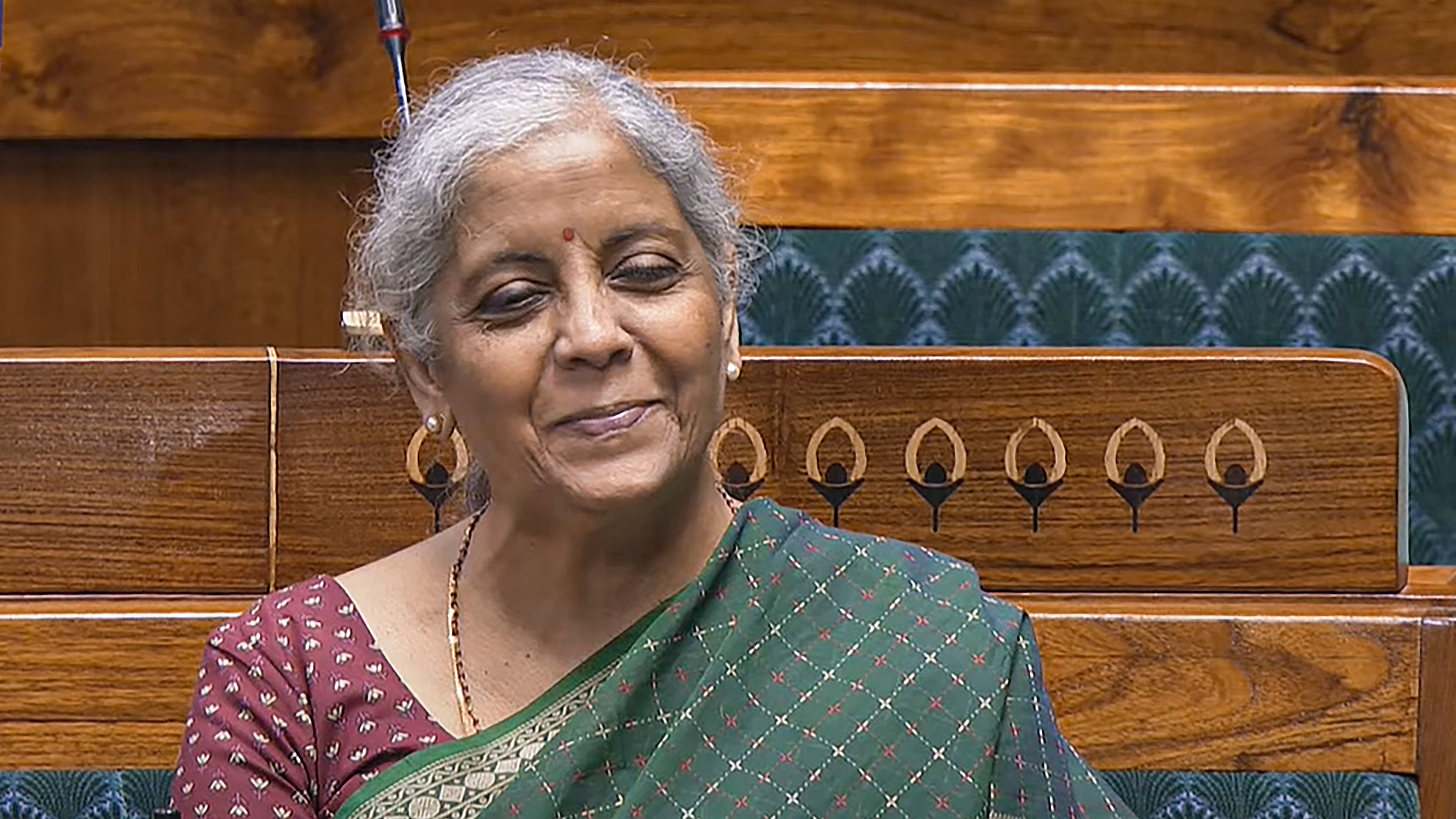 <div class="paragraphs"><p>Union Finance Minister Nirmala Sitharaman reacts in the Lok Sabha during the Monsoon session of Parliament, in New Delhi, Wednesday, July 24, 2024. </p></div>