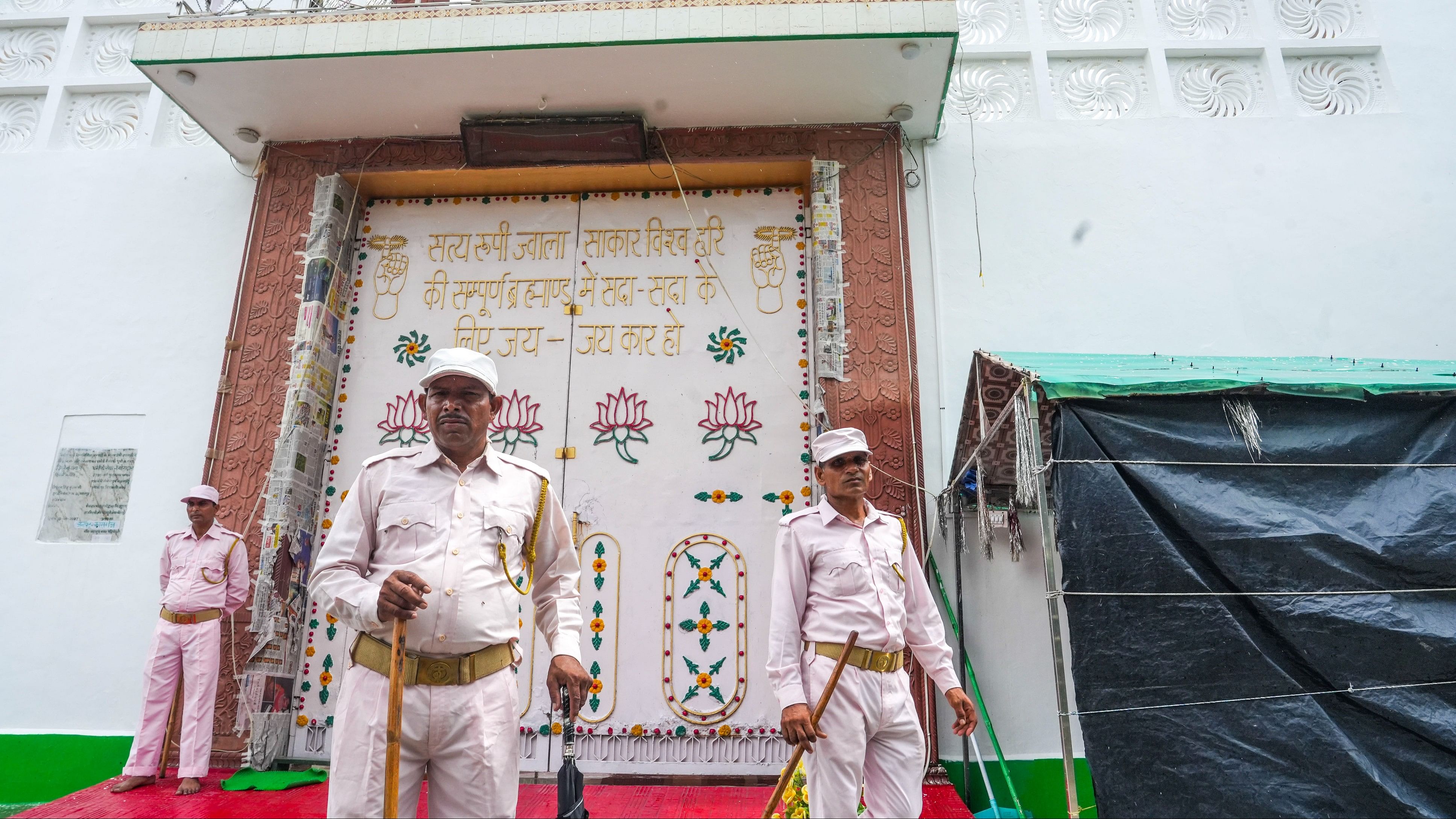 <div class="paragraphs"><p>Security personnel keep vigil outside the 'ashram' of Narayan Sakaar Hari, alias 'Bhole Baba', in Kasganj, on Thursday.</p></div>