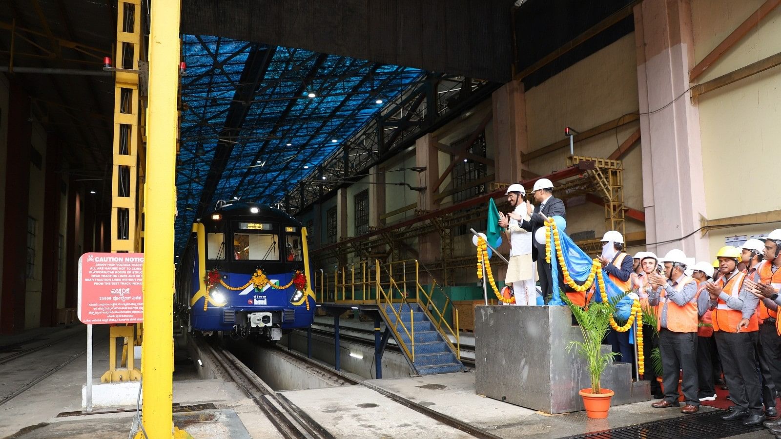 <div class="paragraphs"><p>Minister of State for Defence Sanjay Seth flags off a train made by BEML in Bengaluru for the Mumbai metro network on Monday. </p></div>