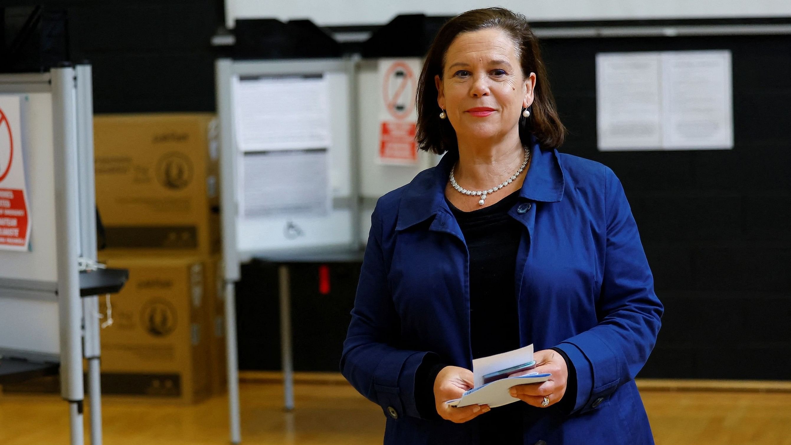 <div class="paragraphs"><p>Sinn Fein President Mary Lou McDonald holds a completed ballot paper as she walks towards the ballot box to cast her vote on the day of the European Union's parliamentary and Ireland's local elections, in Dublin, Ireland, June 7, 2024. </p></div>