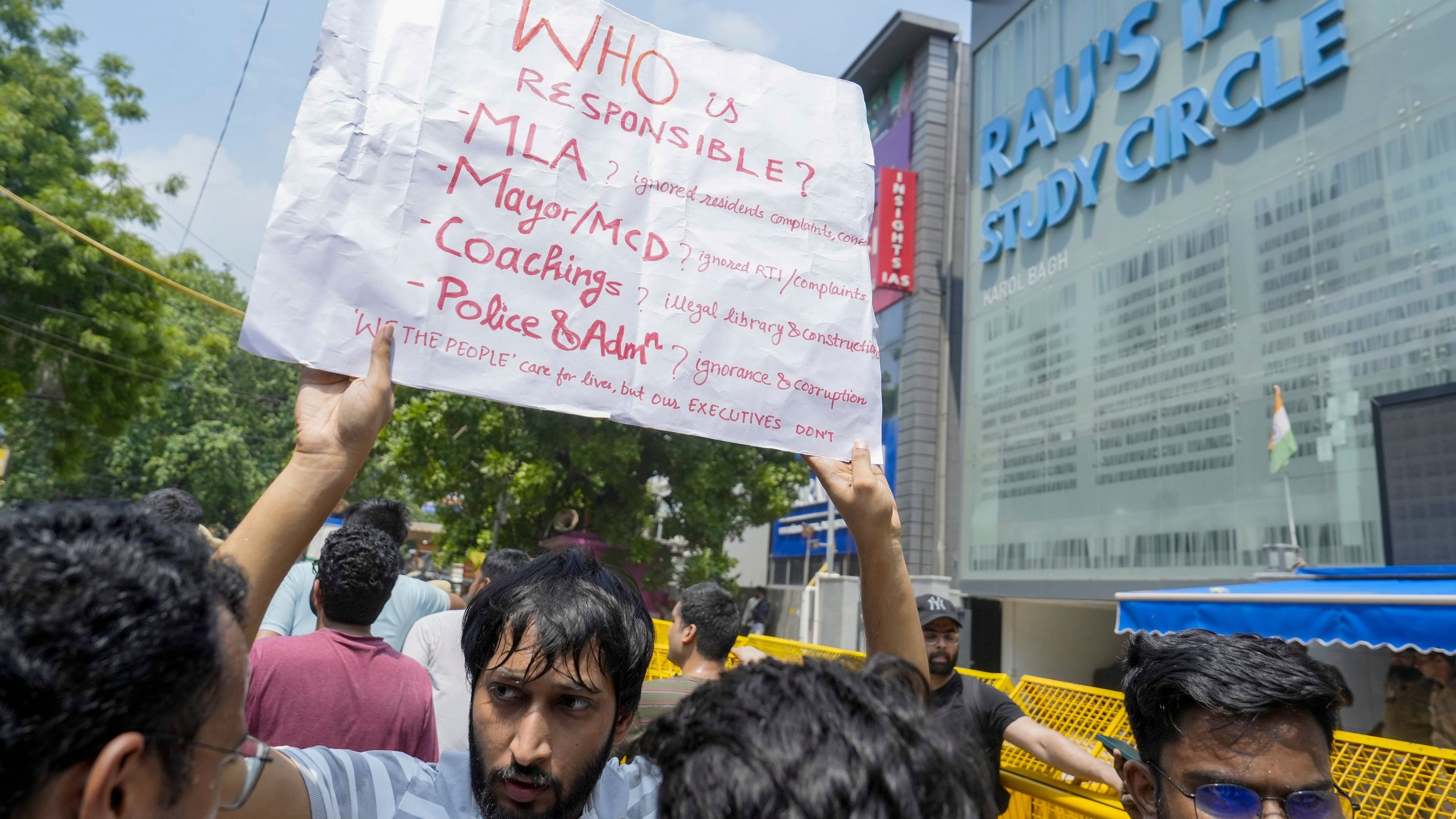 <div class="paragraphs"><p> A student during a protest after three civil services aspirants died due to drowning at a coaching centre in Old Rajinder Nagar area, in New Delhi, Monday, July 29, 2024. </p></div>