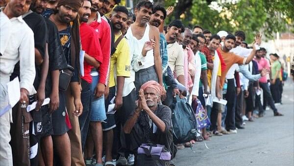 <div class="paragraphs"><p>Pilgrims wait for registration of Amarnath Yatra, at Mahajan Hall registeration counter, in Jammu.</p></div>