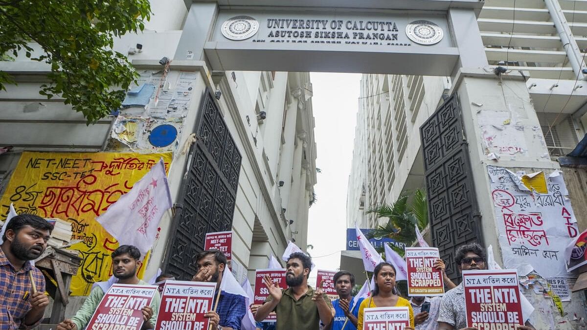 <div class="paragraphs"><p>Agitating students held placards and demanded action against the National Testing Agency which organised the medical entrance examination NEET and the resignation of Union Education Minister Dharmendra Pradhan.</p></div>