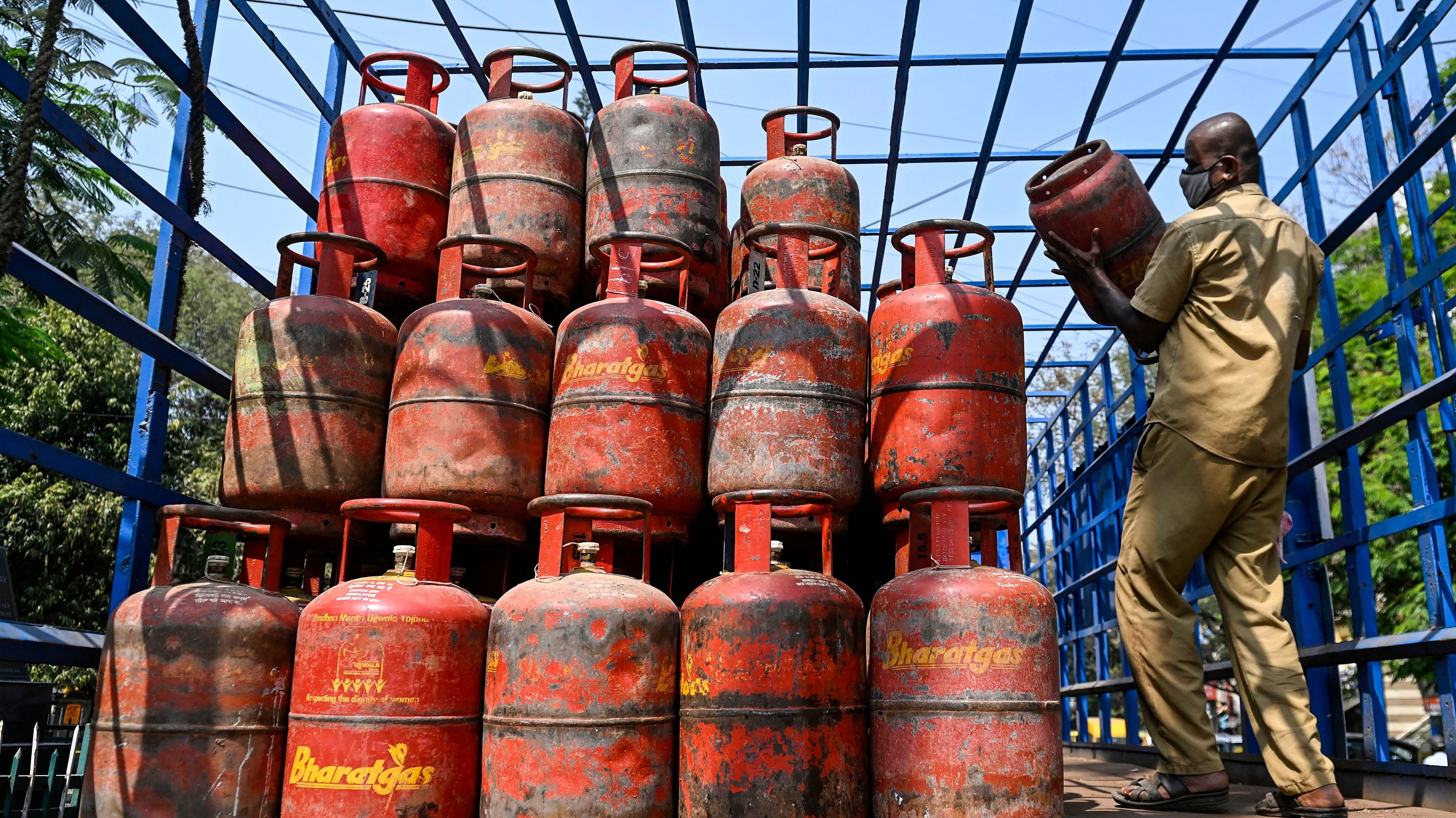 <div class="paragraphs"><p>A worker arranges LPG cylinders in a lorry, at a distribution center in Bengaluru. (Representative image)</p></div>